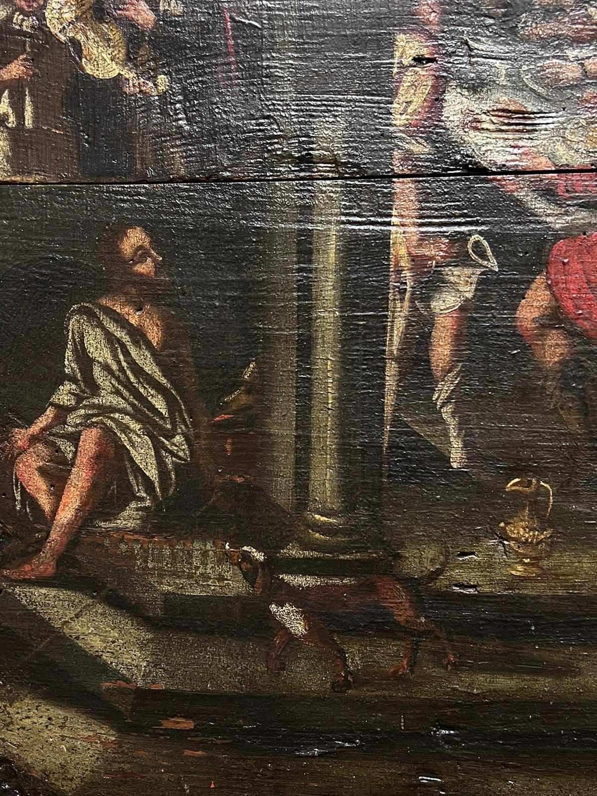Panneau de bois à l'huile de maître du 17e siècle, de style baroque hollandais, avec des figures de banquet et de construction romaine. 1