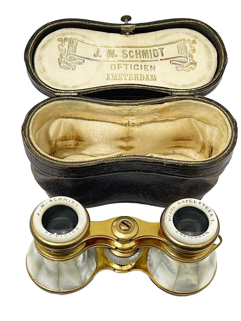 Dutch Opera glasses by J.M.Schmidt, Amsterdam, ca 1890

Mother of pearl Opera glasses with brass adjustable in degrees and length for visibility. The name and address of the optician are marked in the rings on the side where the eyes are viewed. The