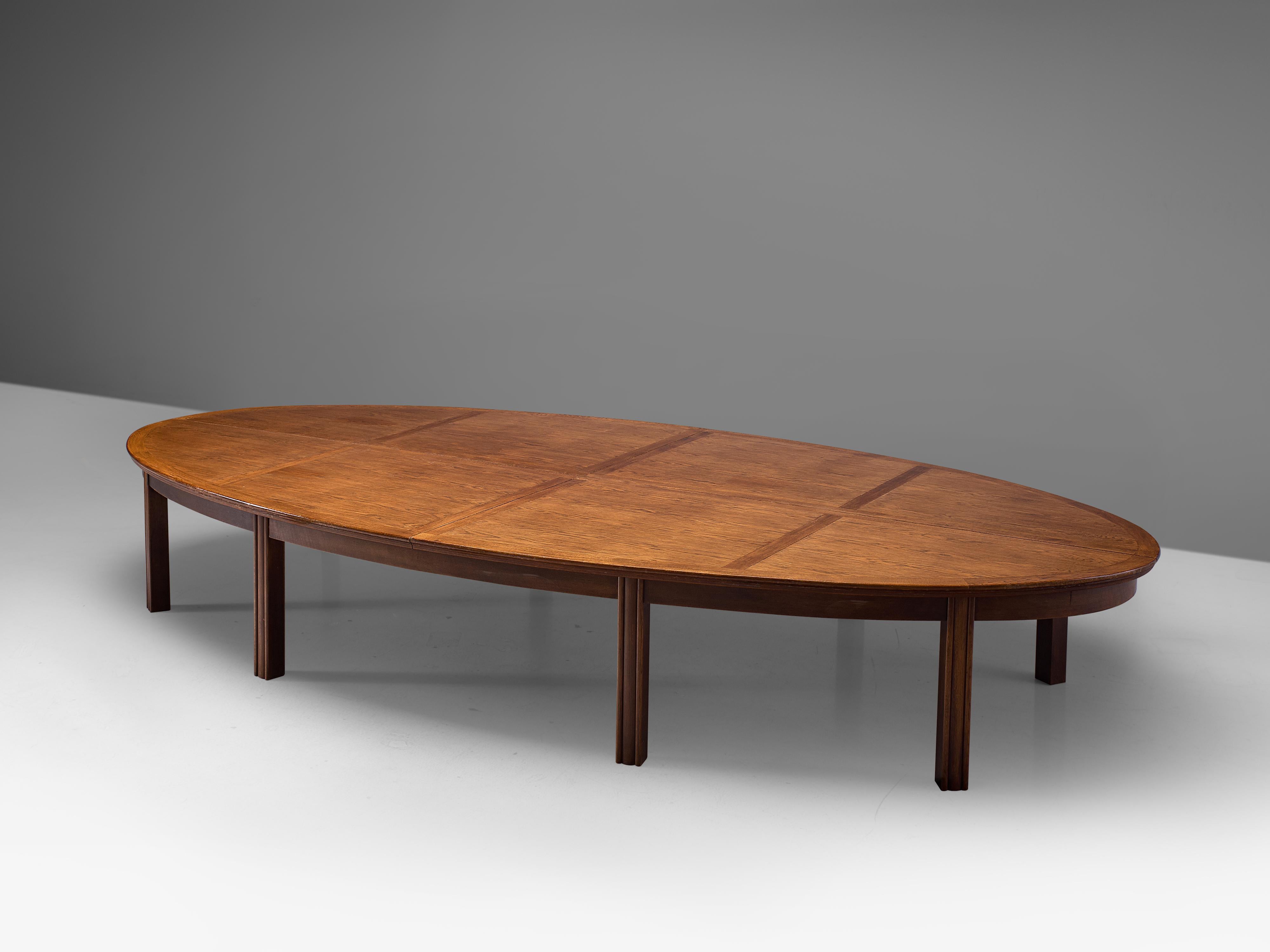 Conference table, oak, the Netherlands, 1950s

Beautiful aged large conference or dining table manufactured in the Netherlands in the 1950s. The wonderfully oval-shaped tabletop is inlayed with oak wood. A grid is created that structures the large
