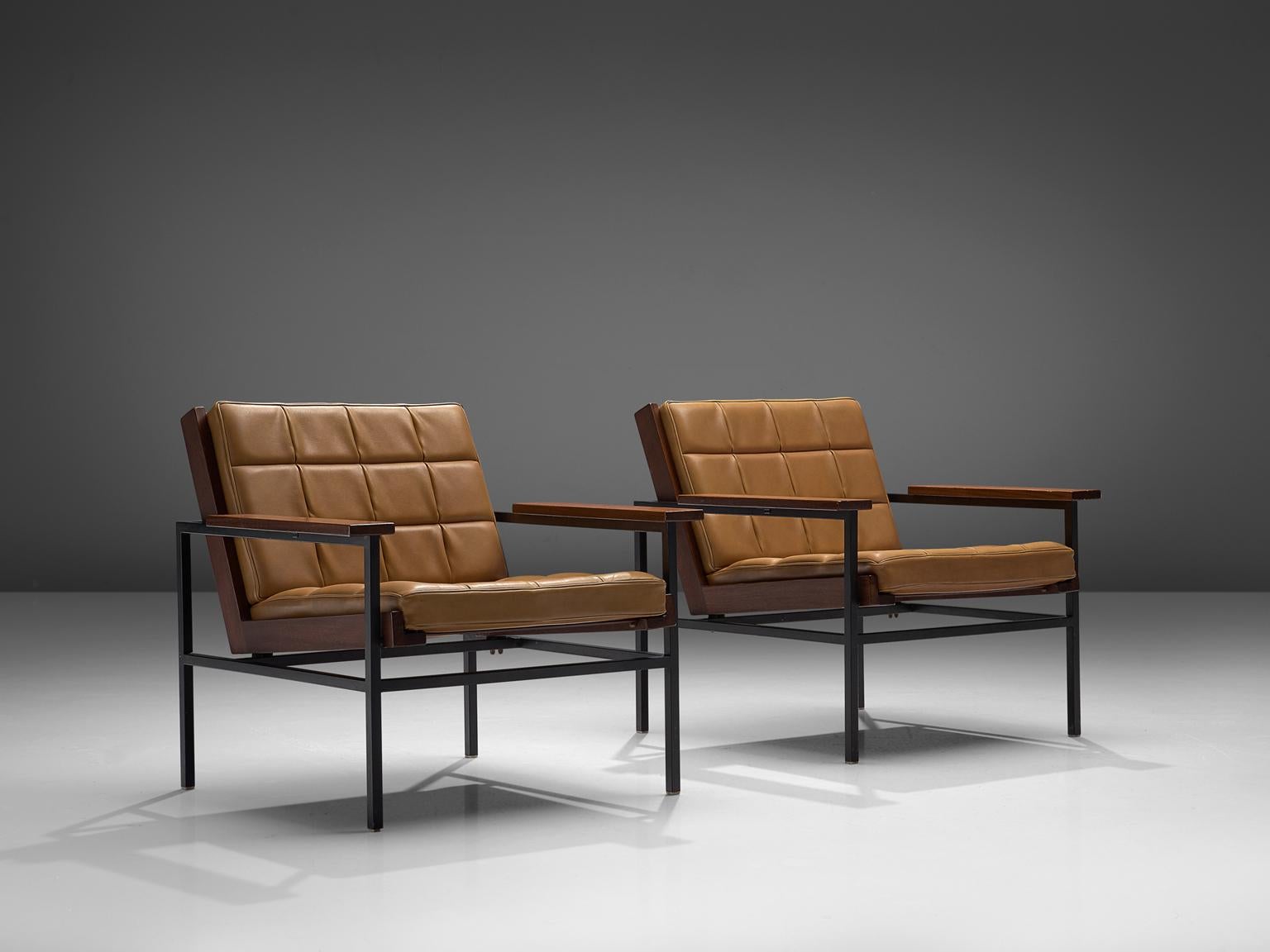 Set of 2 lounge chairs, metal, hardwood and leatherette, The Netherlands, late 1960s.

Modern easy chair made of a brushed steel that holds the wooden frame for the seat. The armrests are made of hardwood as well. The seat contains cushions