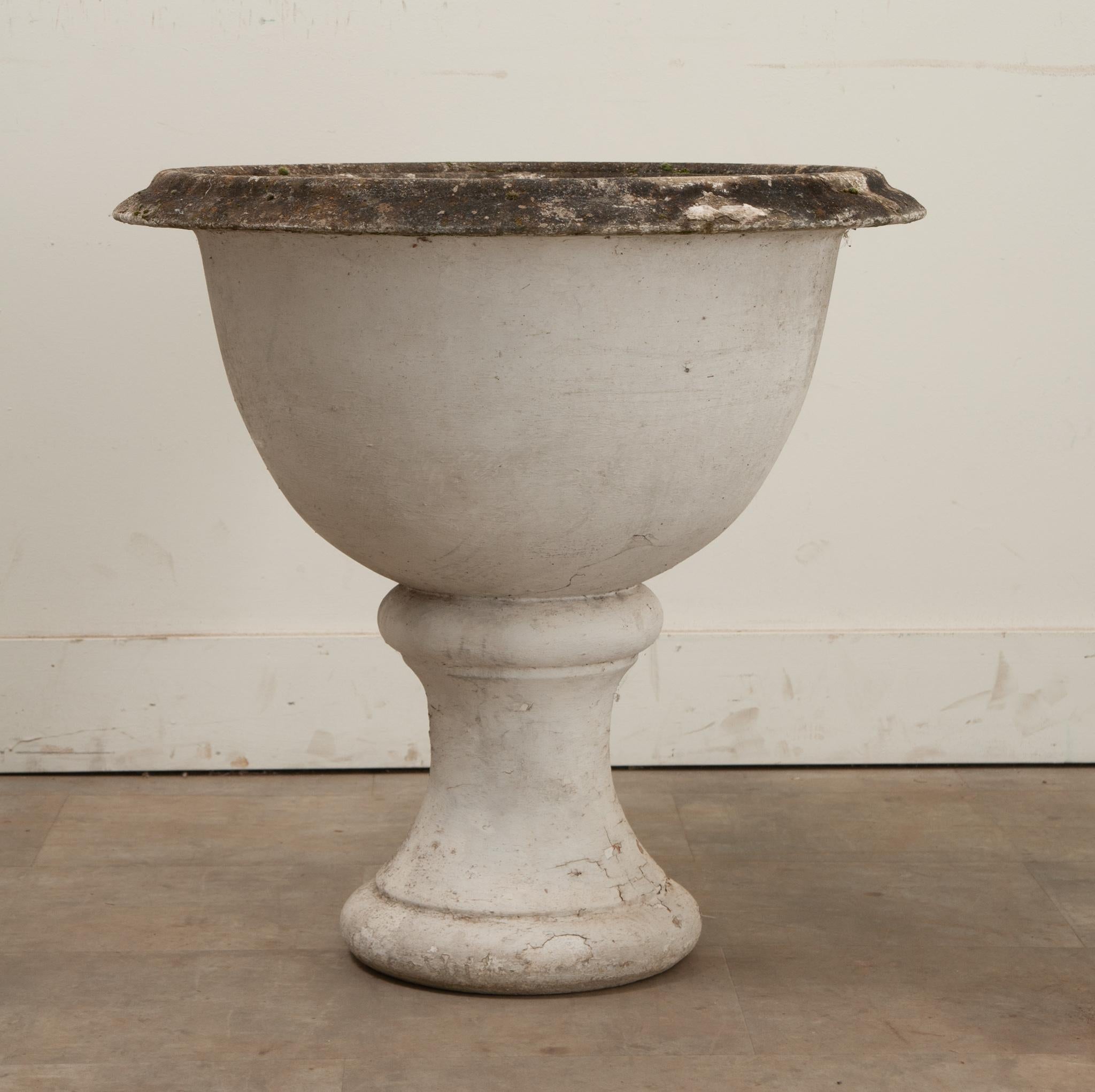 A stone planter from the Netherlands. This impressive planter is made from stone and is shaped to include a pedestal. There is a piece of the planter’s rim missing, be sure to view the detailed images to see the current condition of this garden