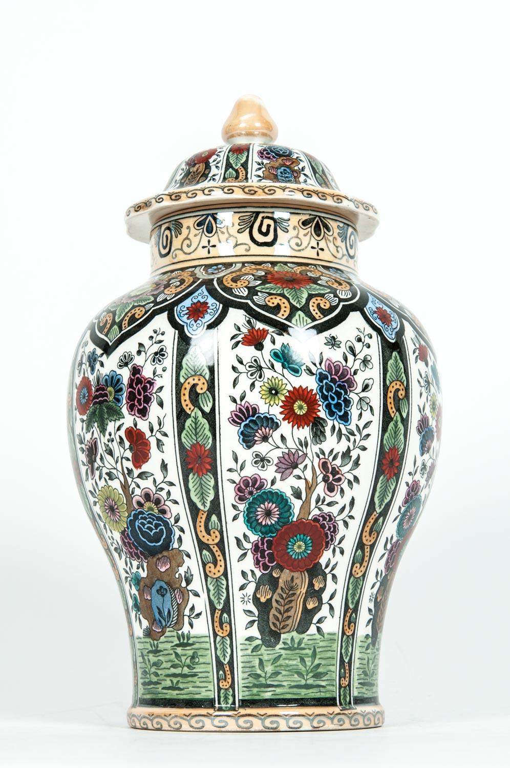 Dutch porcelain vintage decorative covered urn. The covered urn is in excellent condition, maker's mark undersigned. The piece measure about 11.5 inches high x 8 inches diameter.