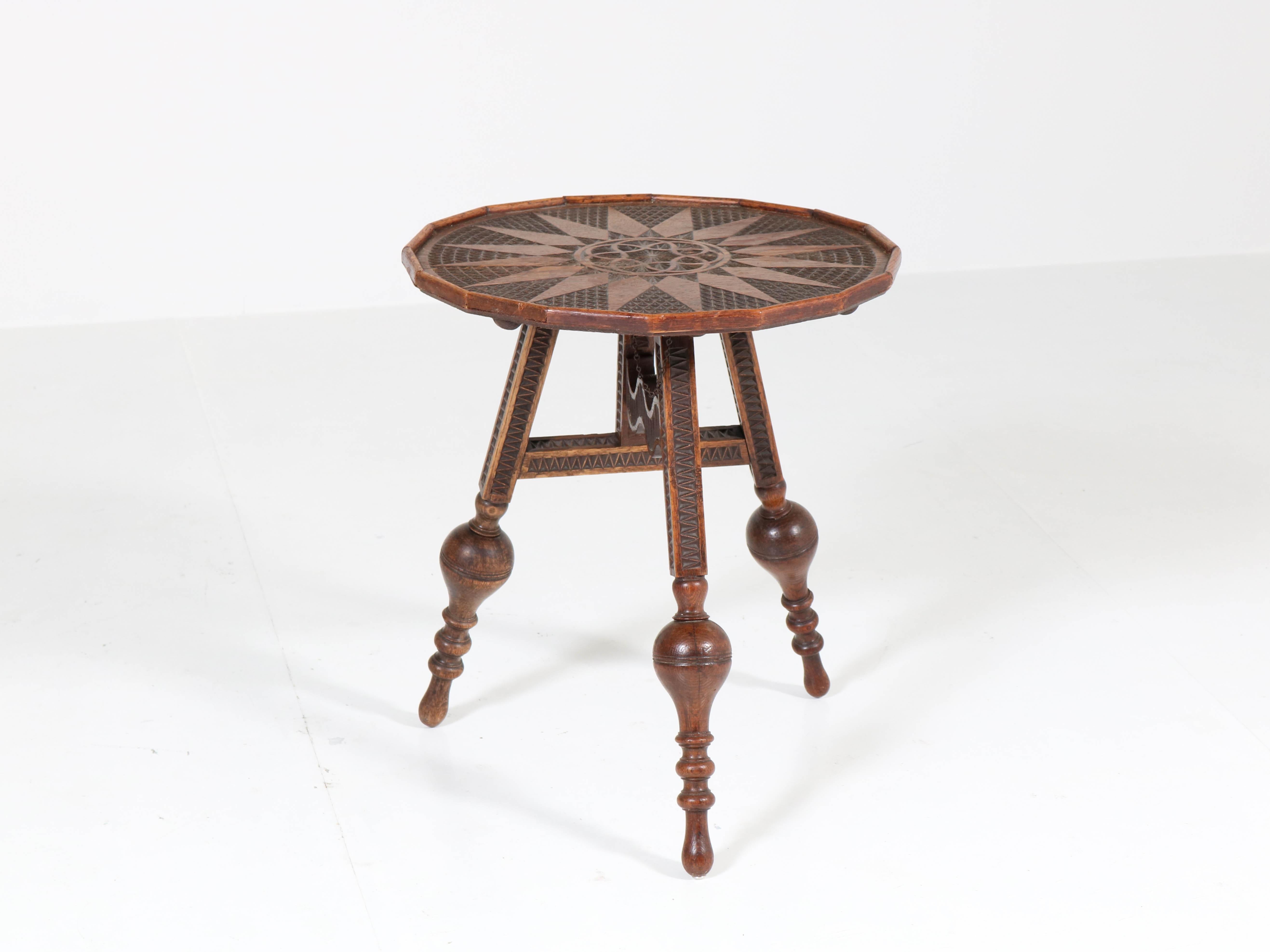 Offered by Amsterdam Modernism:
Wonderful and rare Renaissance Revival tilt-top flap a/d wand table, 1900s
Solid oak with nice carving.
Measurements when tilted: 85 cm or 33.46 in x 50 cm or 19.69 in.
In good original condition with minor wear