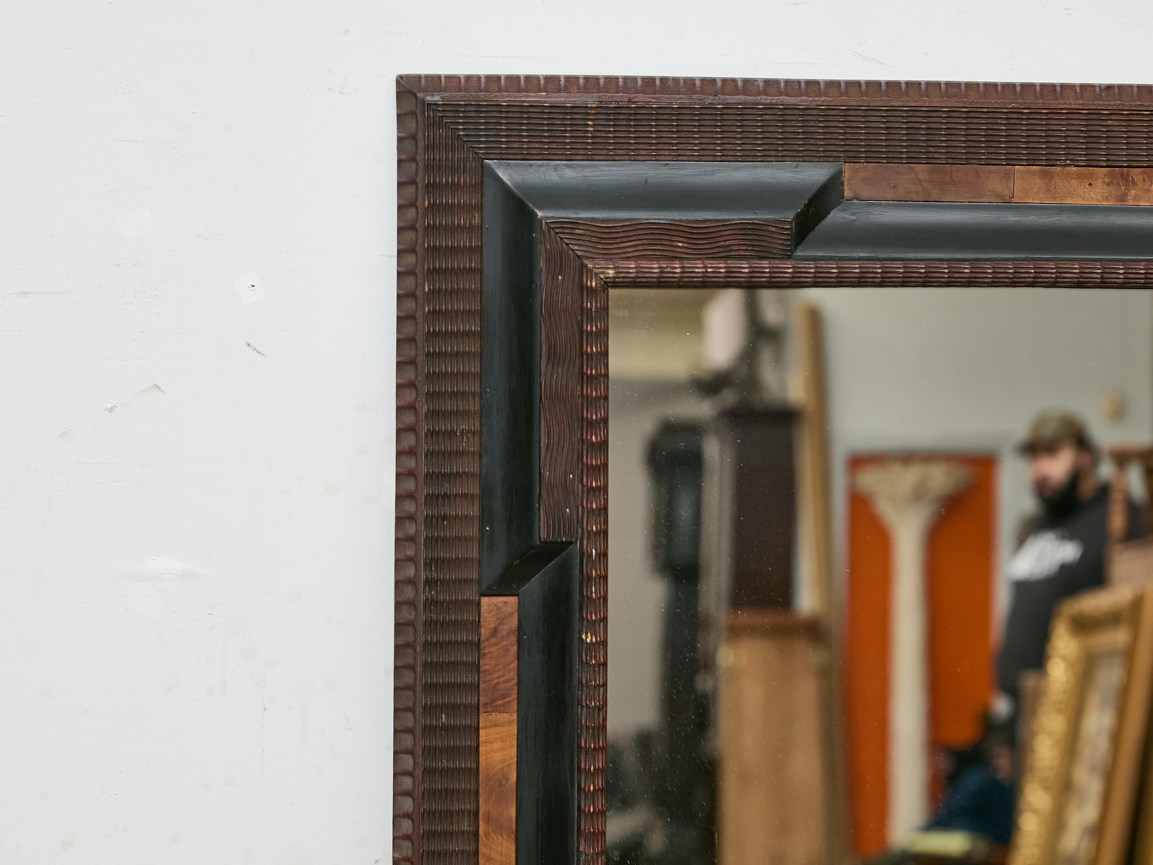 Dutch Ripple-Molded Mirror with Ebonized Accents and Walnut Inlay, circa 1900 In Good Condition For Sale In Atlanta, GA