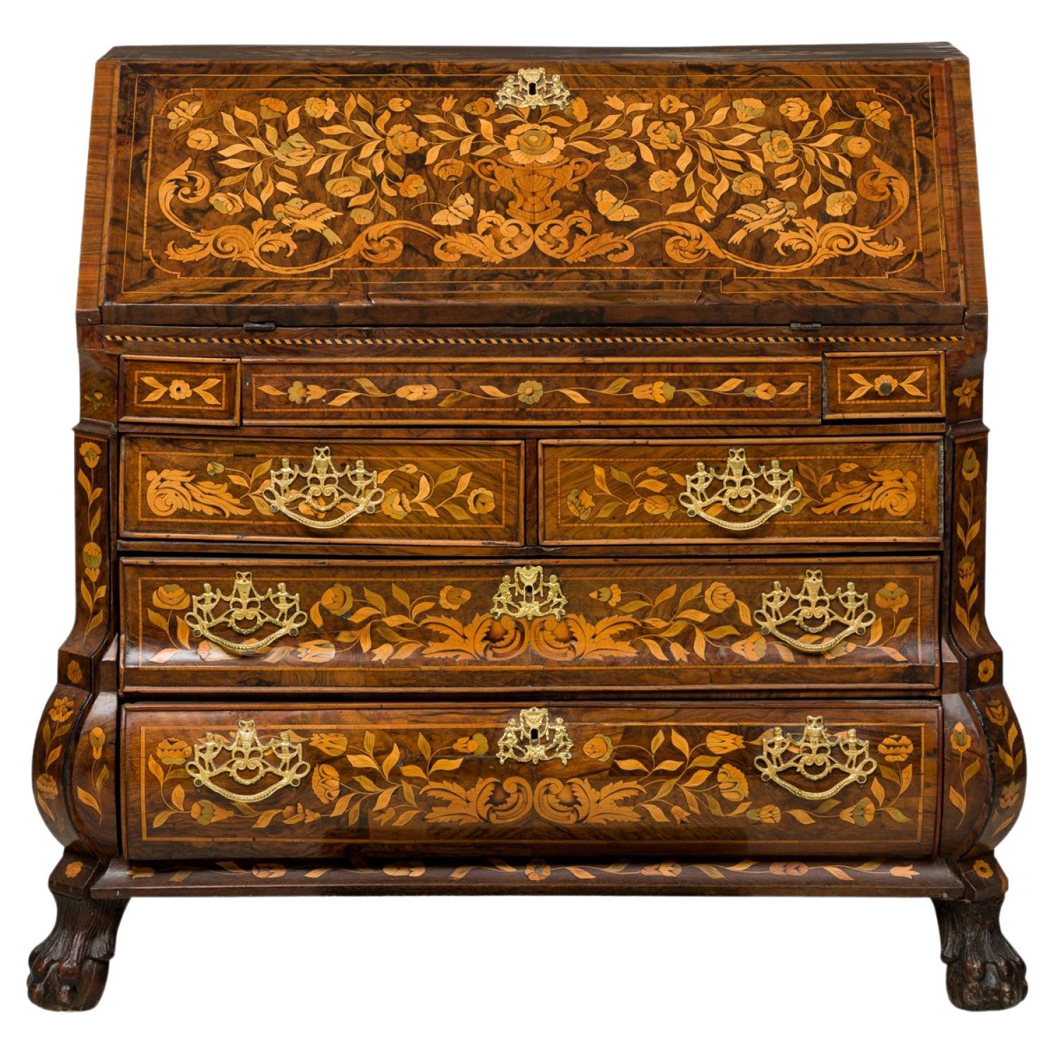 What was the term in French furniture for a writing desk that often featured a drop-down writing surface?