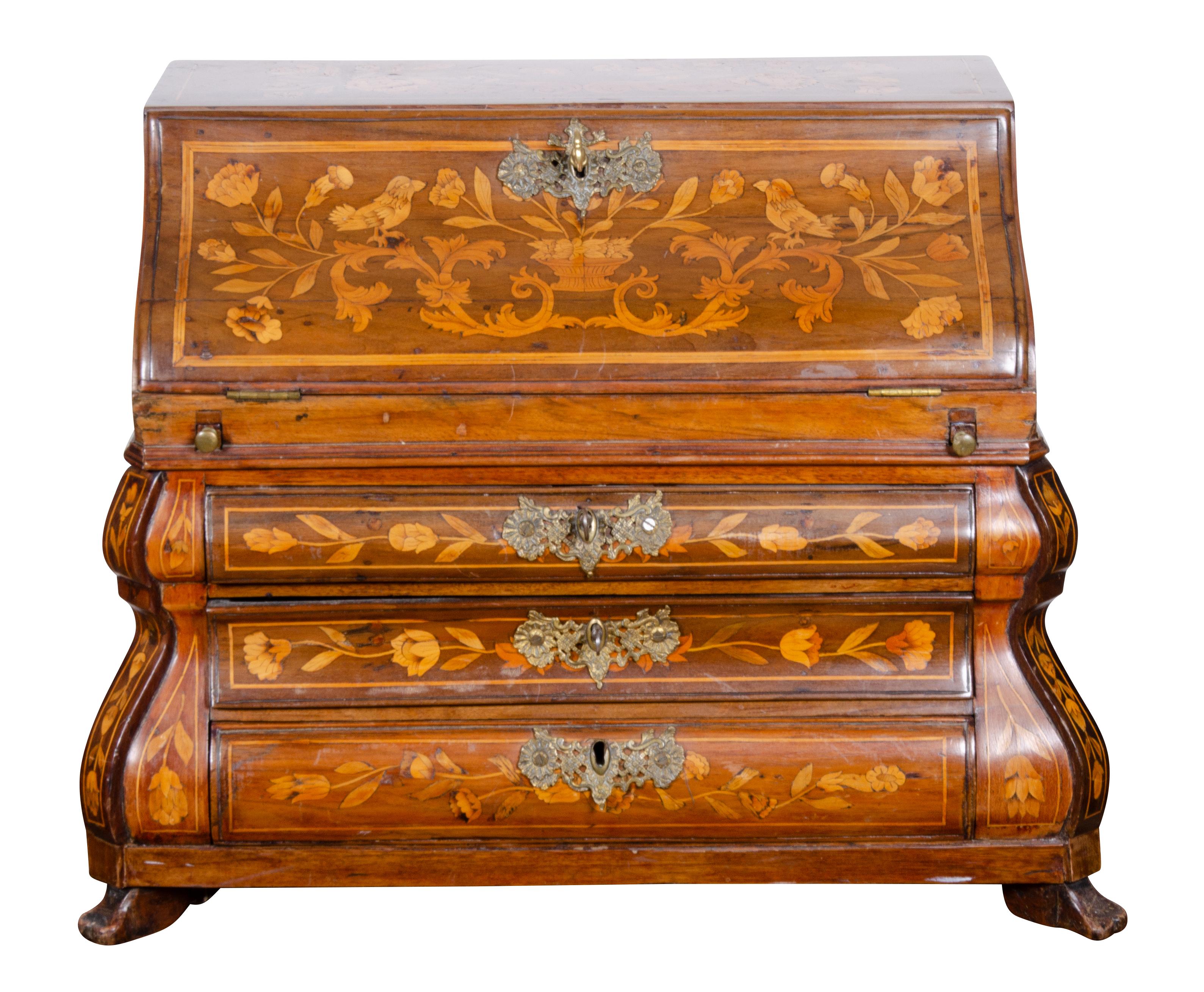 With curved lid opening to a fitted interior with three drawers below and bracket feet. Beautifully crafted in a bombe form. Much time and skill went into making this piece. Sometimes these were used to show the talent of a craftsman or as a sample.