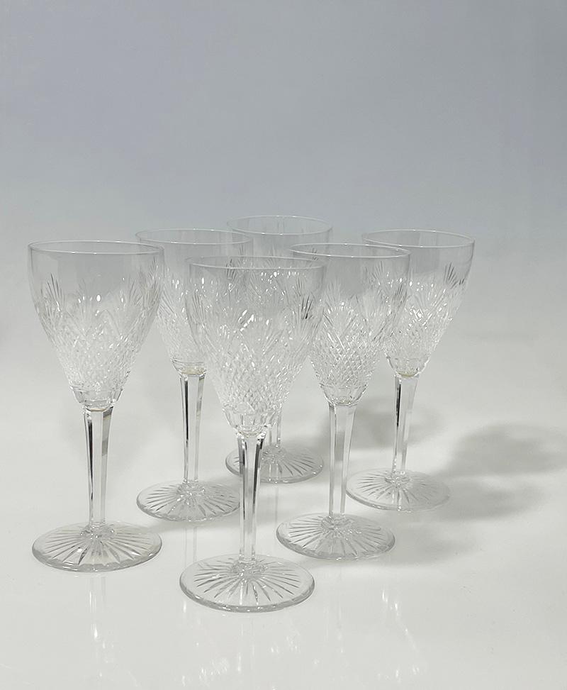 Dutch set of diamond and fan crystal cut decanter and wine glasses, ca 1890

A set of a crystal decanter and six wine glasses. The crystal has a diamond and fan crystal cut pattern.  In the Netherlands this crystal is also called Wilhelmina crystal