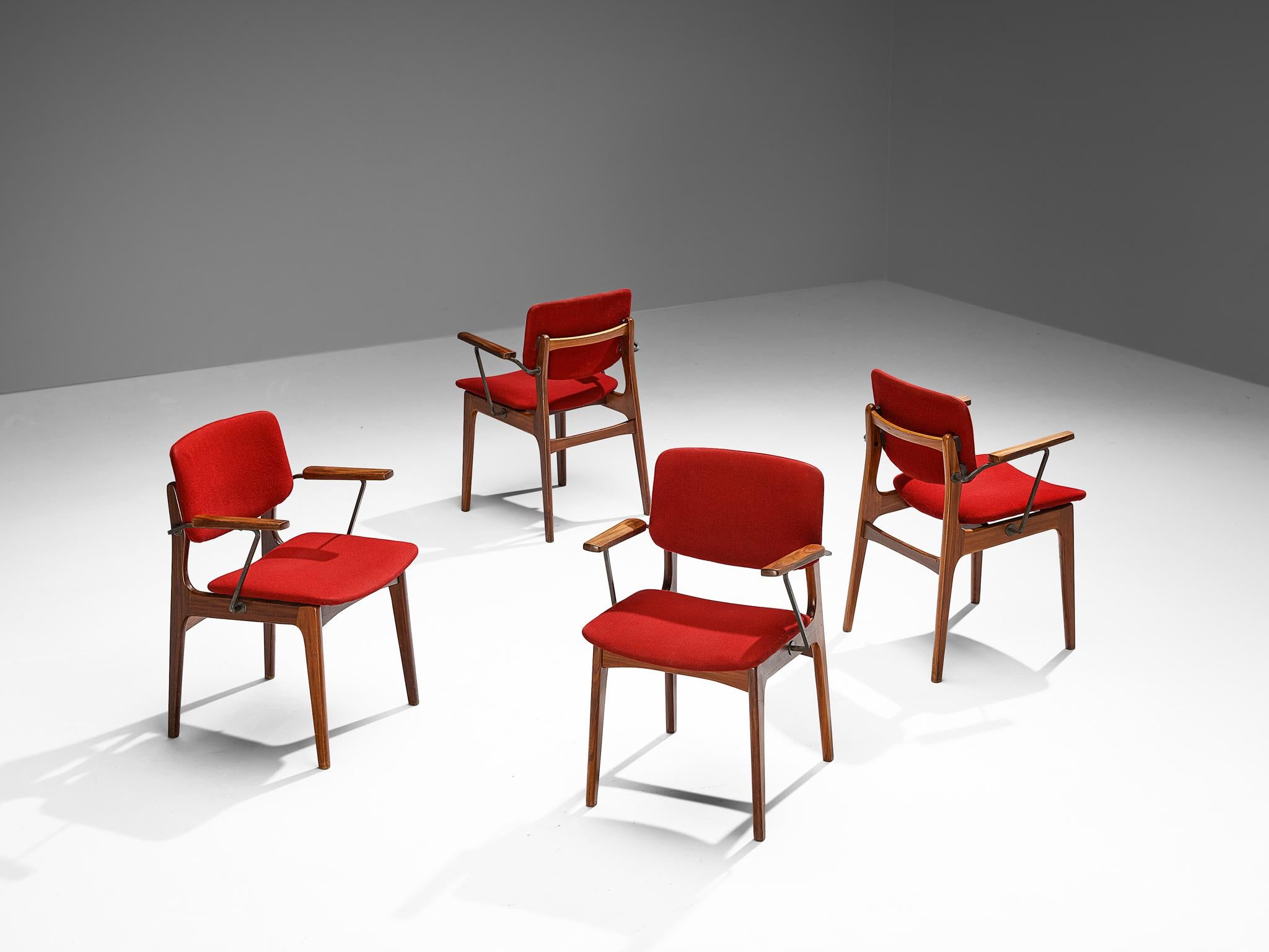 Set of four armchairs, fabric, iron, teak, The Netherlands, 1960s.

These Dutch dining chairs are well-proportioned, featuring a teak frame with angular lines and round edges. The armrests are composed of a wooden slat that are connected to an iron