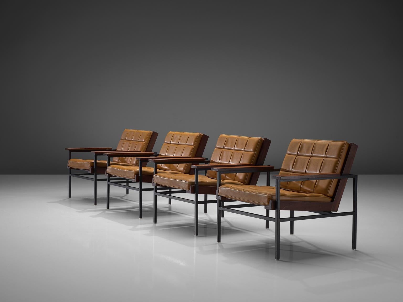 Set of 4 lounge chairs, metal, hardwood and leatherette, The Netherlands, late 1960s.

Modern easy chairs made of a brushed steel that holds the wooden frame for the seat. The armrests are made of hardwood as well. The seat contains cushions