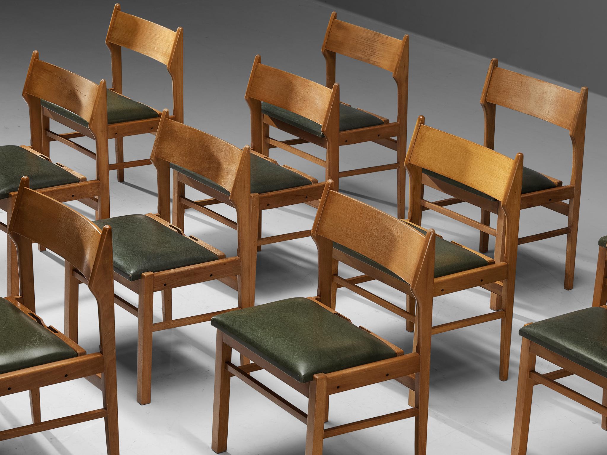 Mid-Century Modern Ensemble néerlandais de douze chaises de salle à manger en bois et similicuir vert foncé en vente