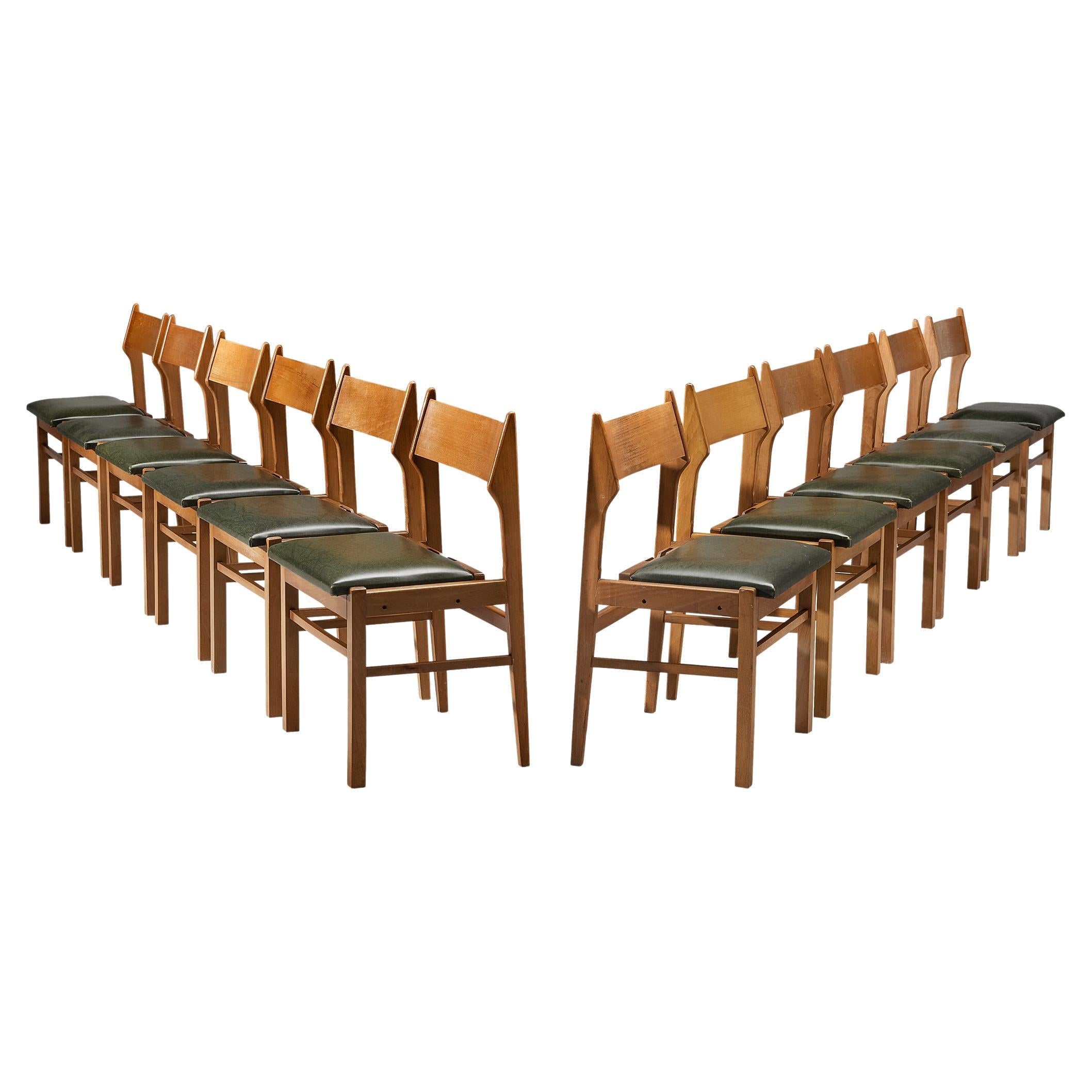 Ensemble néerlandais de douze chaises de salle à manger en bois et similicuir vert foncé