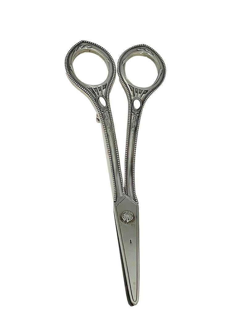 Dutch silver Art Nouveau grape scissors by Kempen & Sons, Voorschoten, ca 1910

A silver grape scissors in Art Nouveau style, raised on two feet for on table. The scissors is completely Dutch silver hallmarked with 