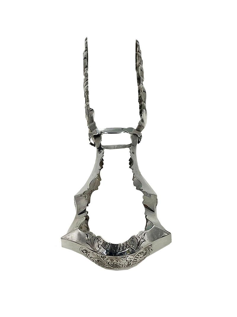 Dutch Silver Asparagus Tongs, by Antonius Hendrikus der Kinderen, 1853

A Dutch silver asparagus tongs with beautiful shapes, both angular and round. The handle is angular and engraved and the edges have a beautiful pattern. The tongs in a graceful