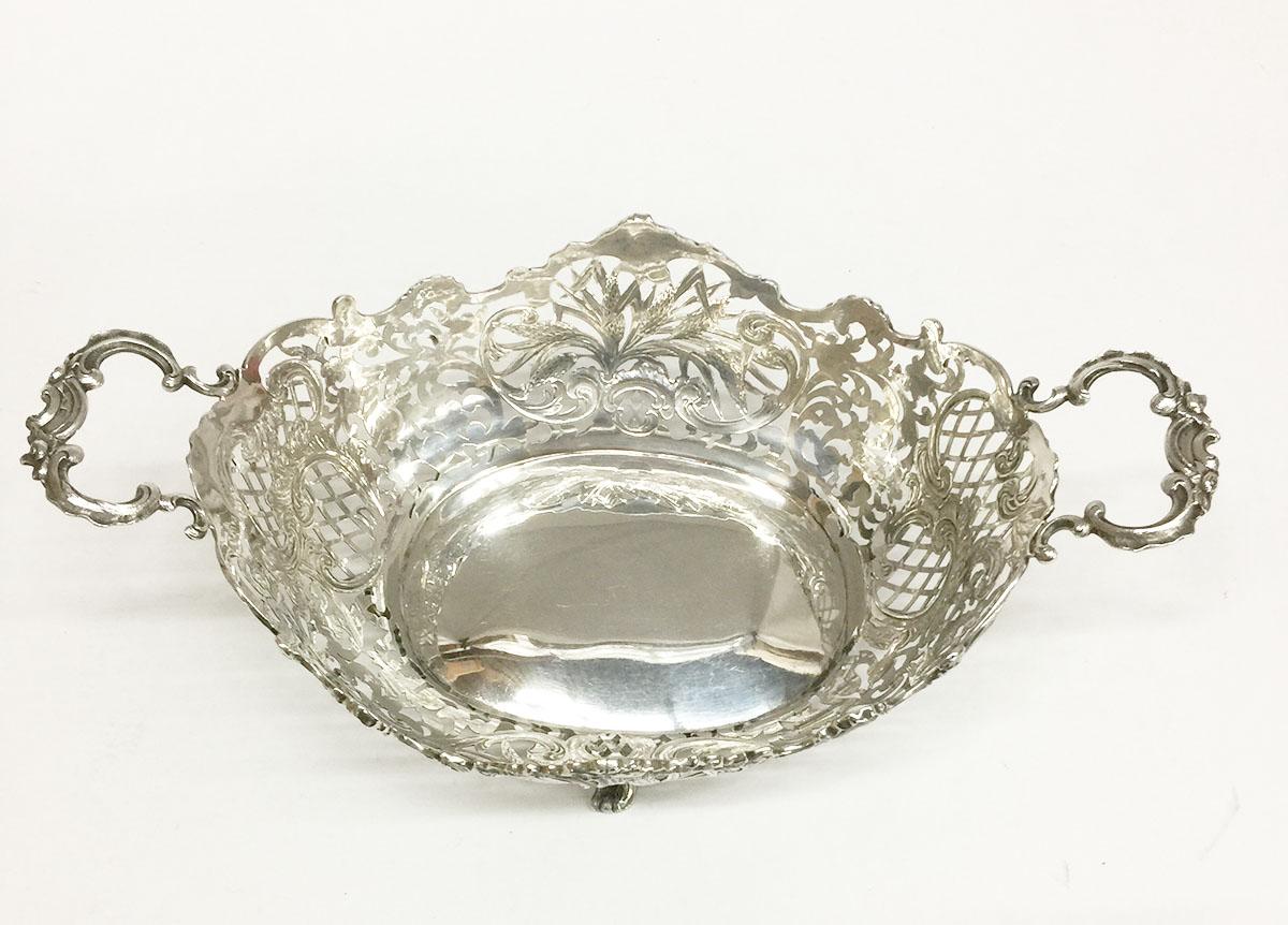 Dutch silver bread basket

An oval Dutch silver bread basket with handles and richly engraved and openwork floral decor and grain motif
The silversmith is H.M. Mansvelt, Rotterdam
Silver purity is 835/1000
Fully marked with the Dutch Silver