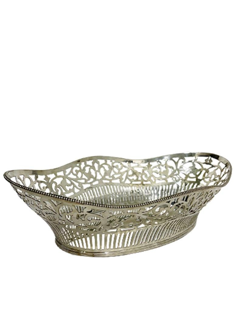 Dutch silver bread basket, Aubert & Zn

An oval Dutch silver bread basket with openwork decor. 
The silversmith is Aubert & Zn. D.J. Aubert, Den Haag- Voorburg ( 1958- )
Silver Hallmark ZII, Silver purity is 835/1000
Master sign of Aubert &