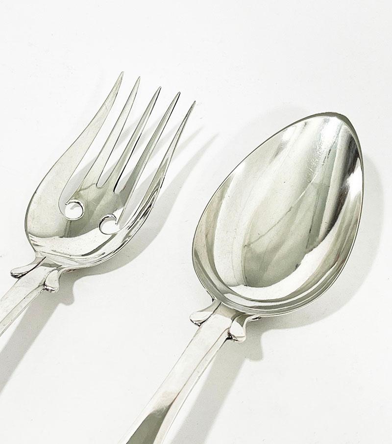 Dutch silver lettuce place setting by J.H. Eversbag & D. van Outvoorst 1884/86

Fork and spoon to serve lettuce with double round fillet handles
Made by Jan Hendrik Eversbag & Daniel van Outvoorst, Amsterdam, worked during 1873-1892
The Hall