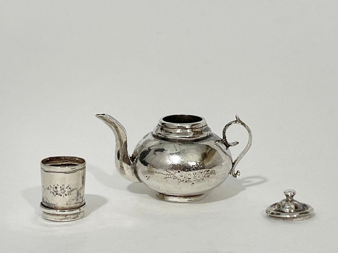 Dutch silver miniature coffee pot by Johannes Hendrik Bing, 1847-1878

A Dutch silver miniature coffee pot with filter and lid. The coffee pot and the filter with floral decoration. Dutch silver hallmarked with the old sword, used between 1814 and