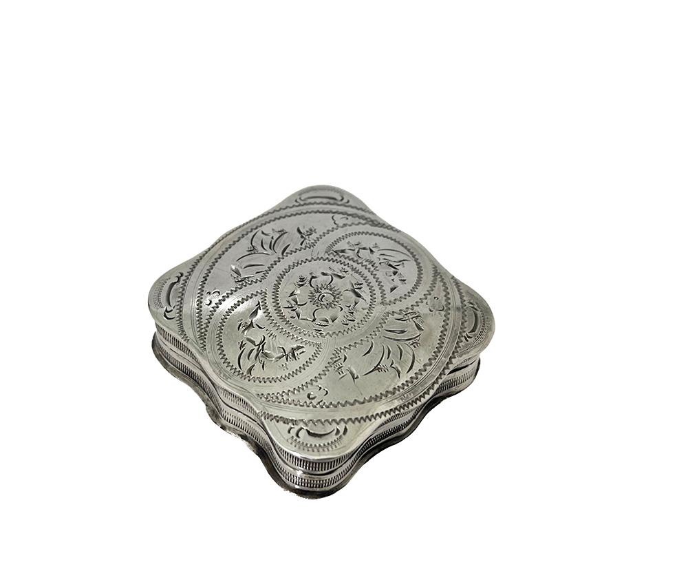 Dutch silver pill box, 1863

A Dutch silver small cartouche-shaped pill box with engraved floral decor on the lid. The silver box has a hinged lid. The box is Dutch silver hallmarked with Lion 2 (833 /000 purity of silver)
The silver hallmark
