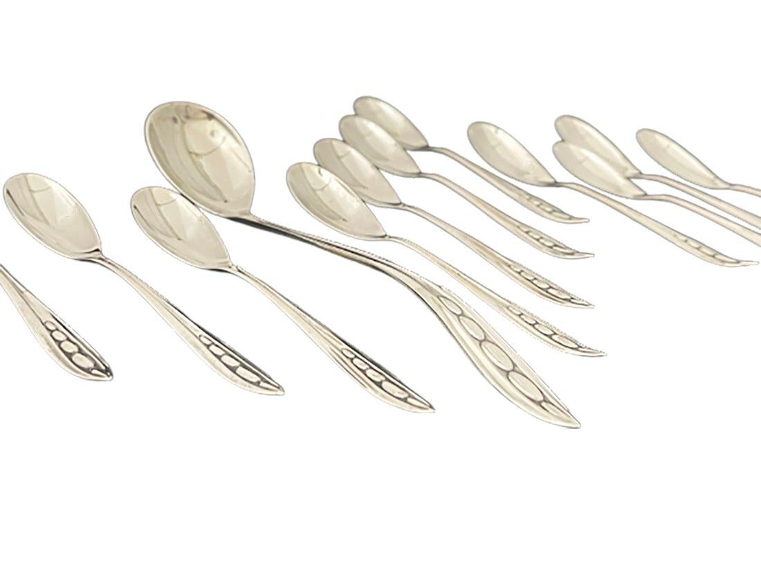 Dutch silver set by Gerritsen and van Kempen, 1945

A jam spoon and 16 large teaspoons with long oval spoon body and the handle in a point with graceful oval curves incorporated. Made by Gerritsen & Van Kempen, N.V., Zeist, The Netherlands Master