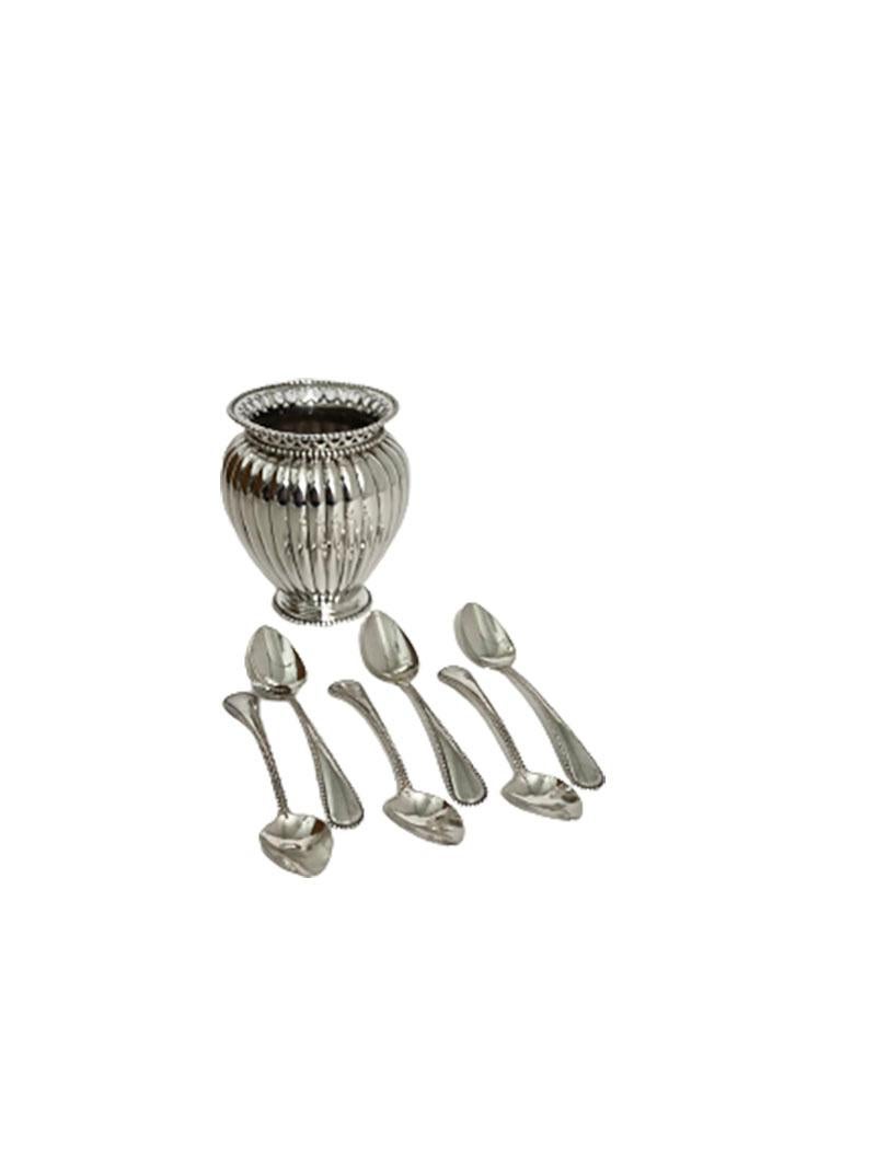 Dutch silver spoon vase, Van Kempen & Zn, Voorschoten, 1896

Silver spoon vase with ribbed body and openwork with pearl pattern rims
The silver spoon vase is marked with the Dutch silver hallmark and is made by Fa. J.M. van Kempen & Zn,