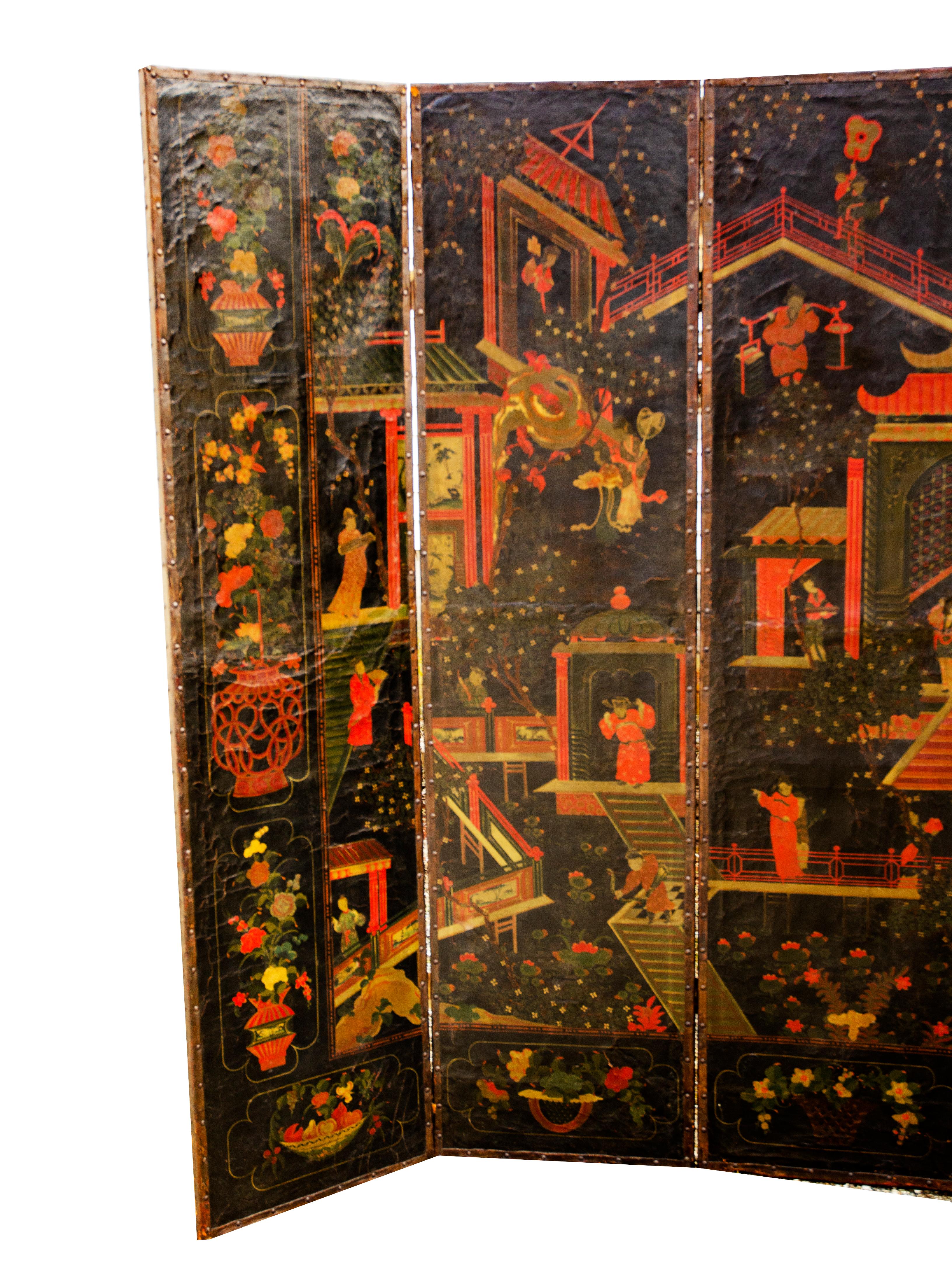 Tall grand scale with six panels with reds and greens on a black background. Decorated with pagodas and people doing a variety of whimsical things.