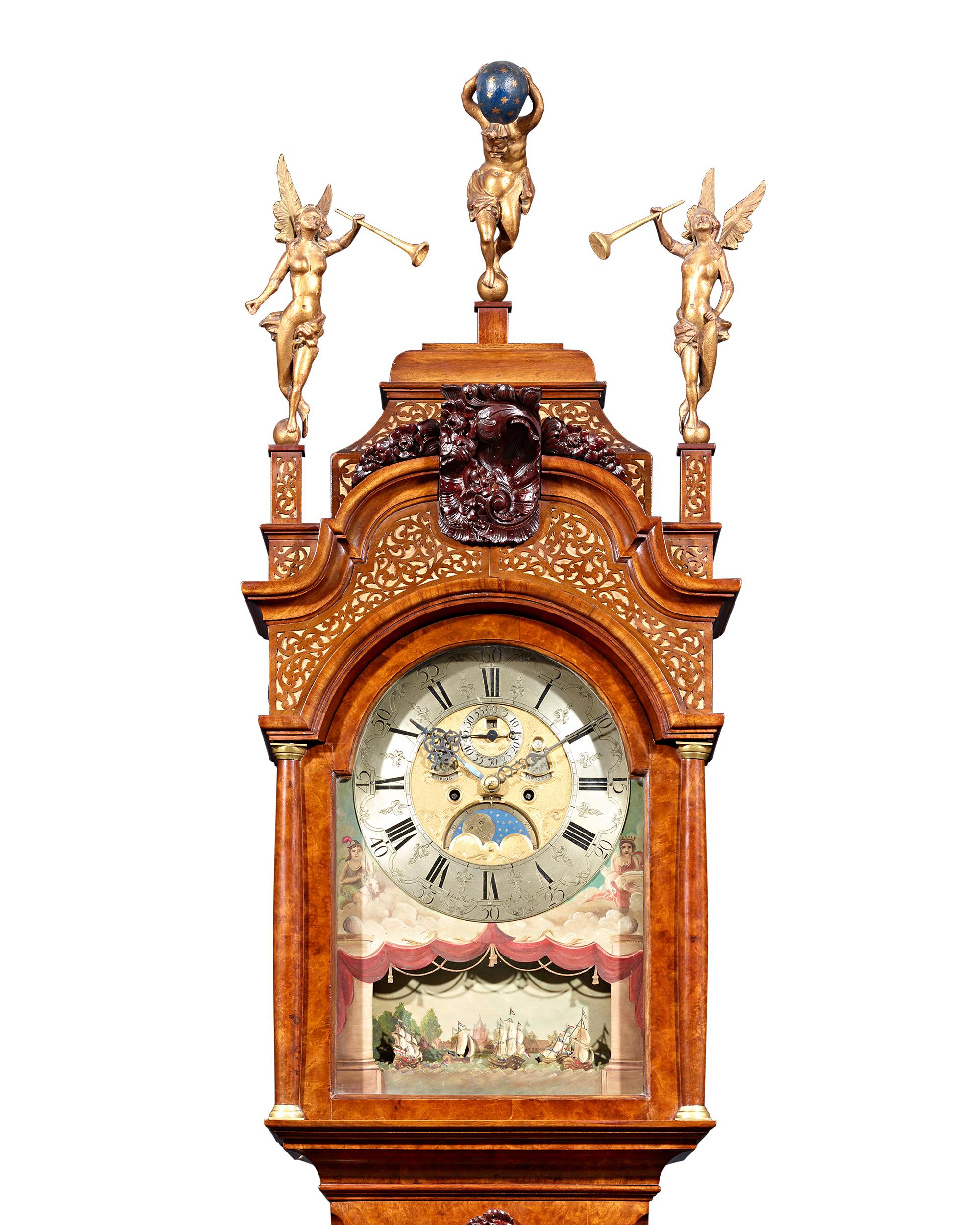 An incredible example of 18th century Dutch clock making, this marvelous tall case clock (also known as a longcase or grandfather clock) was crafted by Jonah Smith of Amsterdam. The late Baroque-style case is exemplary of those clocks commissioned