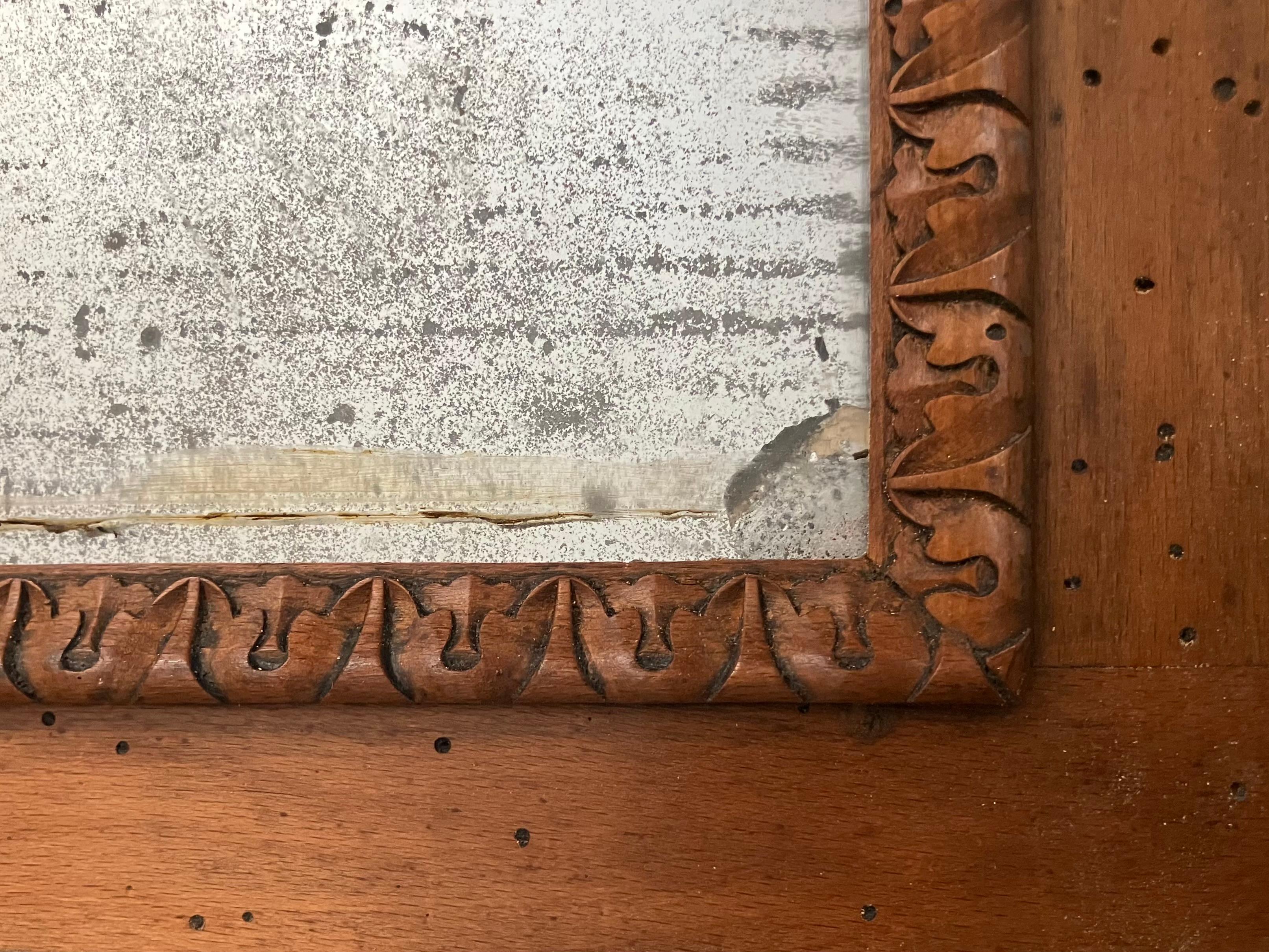 Dutch Style Mirror. Antique Mannerist / Flemish style mirror in original light walnut with corner block trim detail and  mercury glass plate. Italy, late 19th century

Dimensions: 32