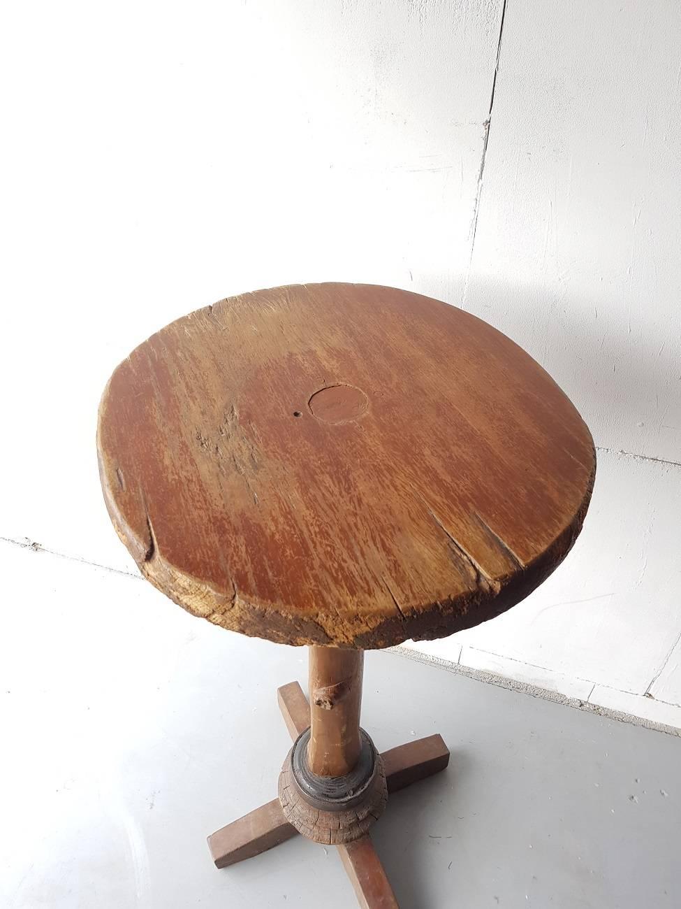 Dutch vintage wooden pub table made from a tree trunk and two old wooden shafts second half of 20th century.

The measurements are,
Depth 53 cm/ 20.8 inch.
Width 53 cm/ 20.8 inch.
Height 105 cm/ 41.3 inch.
 