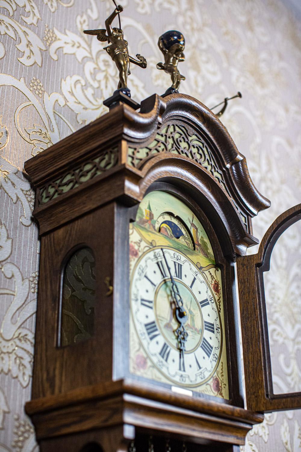 Porcelain Dutch Wall Clock Stylized as Staart From the Early 20th Century in Oak Case