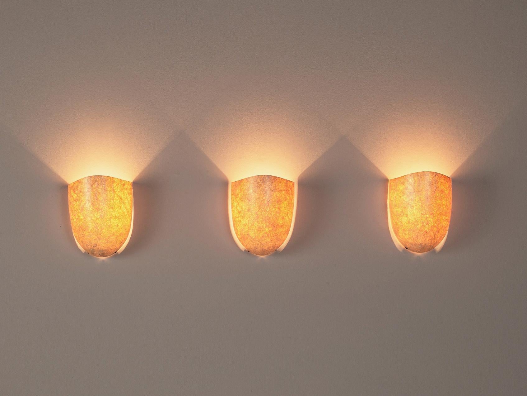 Philips, wall sconces, metal, fiberglass, the Netherlands 1970s.

Artistic wall lights of the seventies that embody a nice textured surface of intersecting lines. As a consequence, a transparent and atmospheric light is created. A simple design