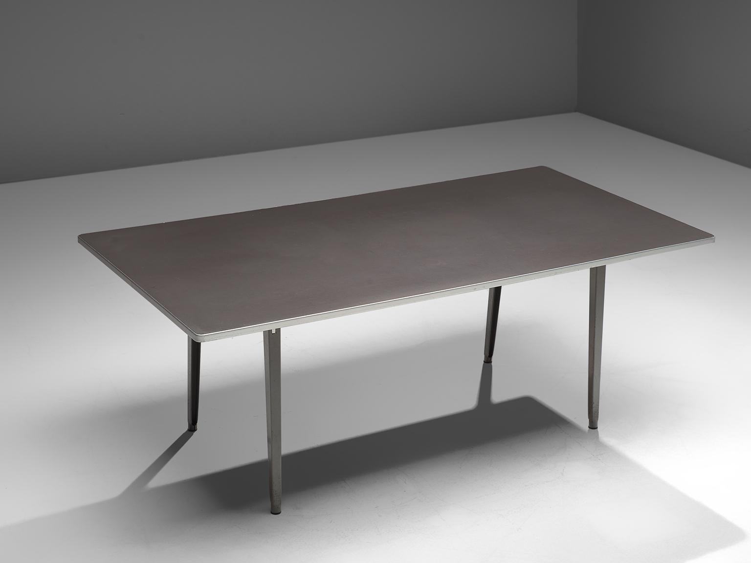 Friso Kramer for TH delft , conference table, metal, The Netherlands, 1940s. 

This work table is designed by Friso Kramer in the 1940s. The table features a modest design, with slightly tapered legs that are tilted. This table is an example of the