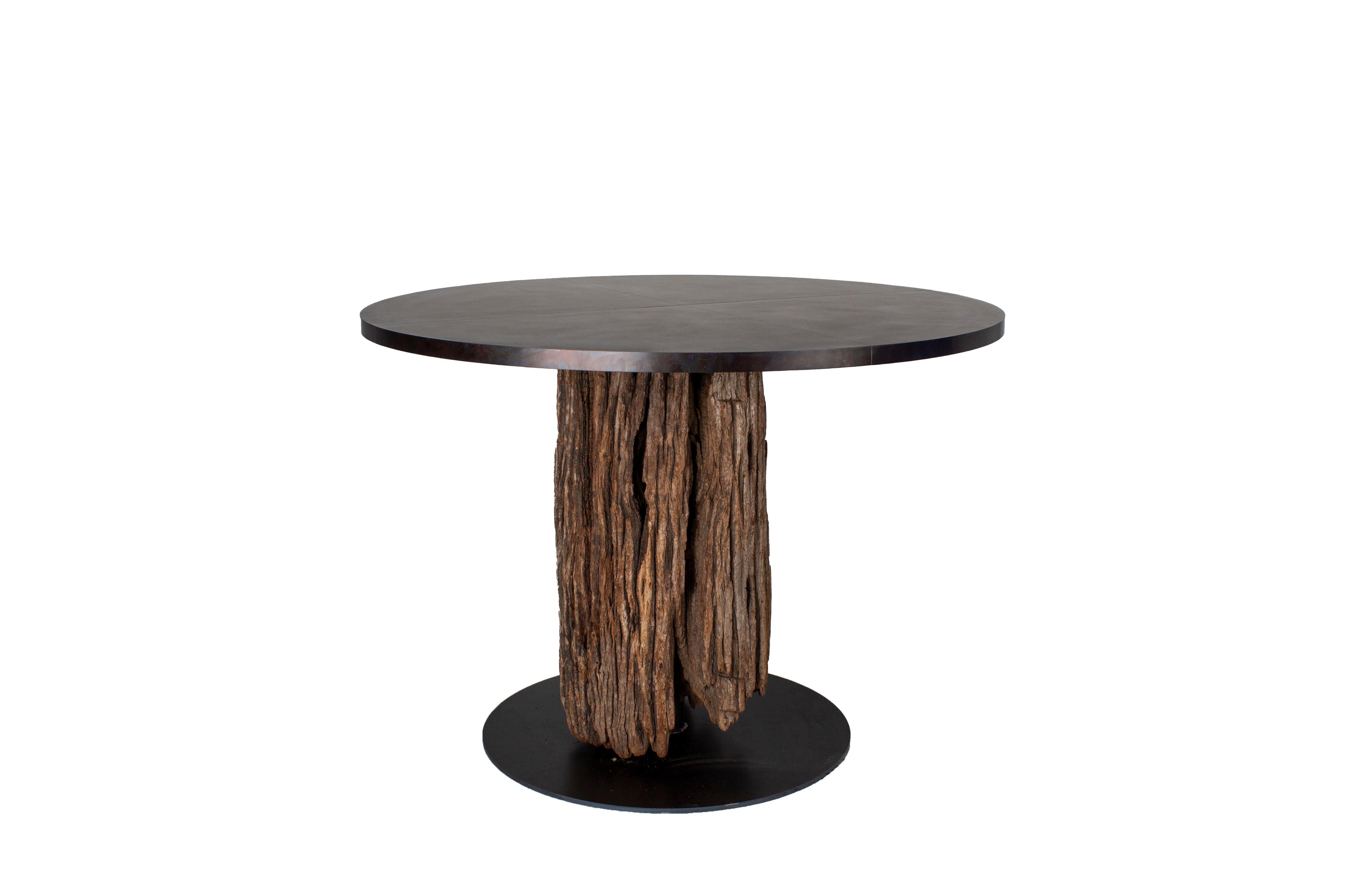 Organic form bar table in weathered South Asian iron wood on steel mount. Iron wood has been used for hundreds of years by the Dutch in Indonesia for building marine structures, docks, quays, piers.

The log I used in creating this table was chosen