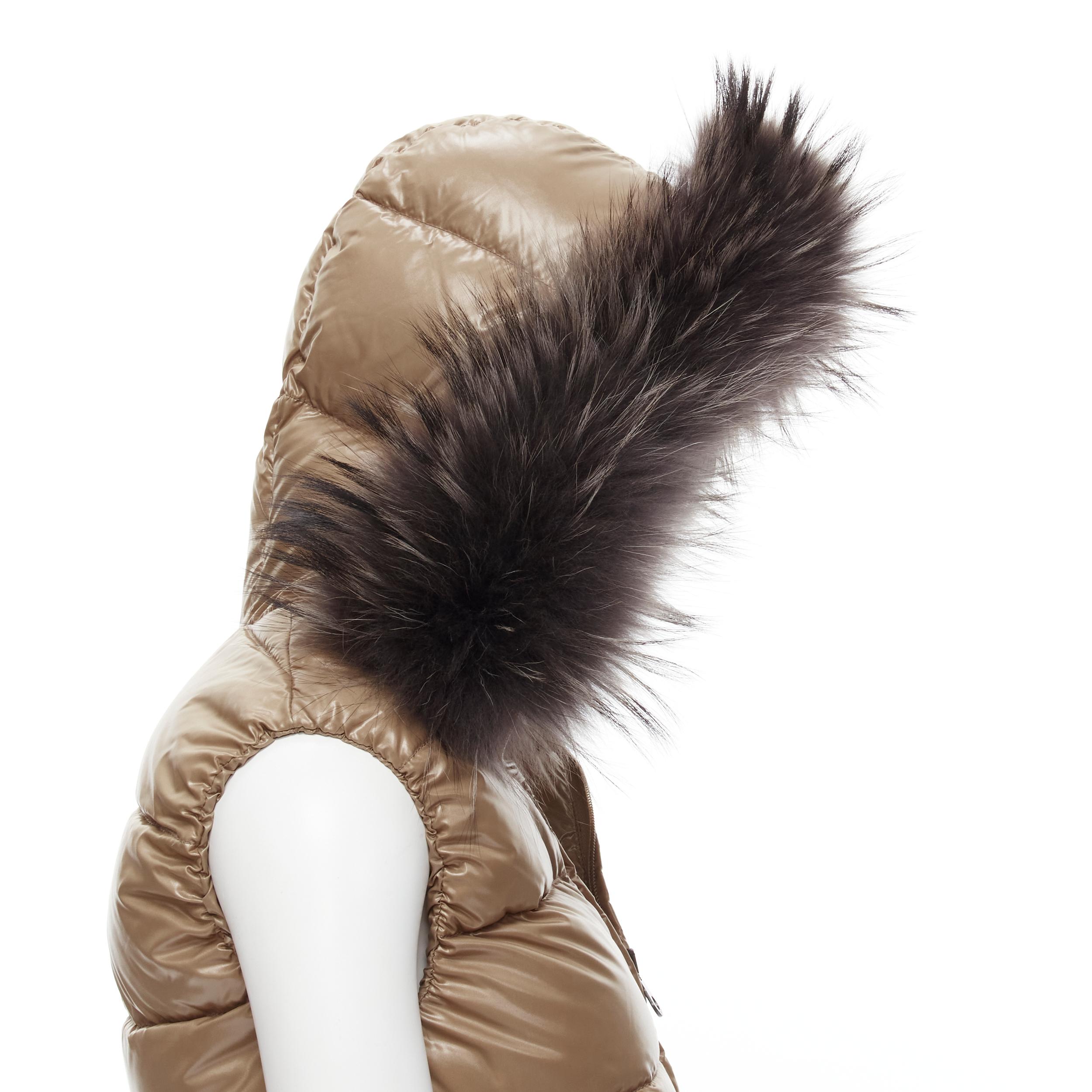 DUVETICA Pure Goose New Down brown fur hood padded vest jacket IT38 XS 
Reference: LNKO/A01840 
Brand: Duvetica 
Material: Nylon 
Color: Brown 
Pattern: Solid 
Closure: Zip 
Extra Detail: Pure Goose New Down. Brown nylon. Genuine fur trimmed hood.