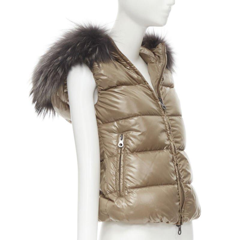 DUVETICA Pure Goose New Down brown fur hood padded vest  jacket  IT38 XS
Reference: LNKO/A01840
Brand: Duvetica
Material: Nylon
Color: Brown
Pattern: Solid
Closure: Zip
Lining:  Nylon
Extra Details: Pure Goose New Down. Brown nylon. Genuine fur