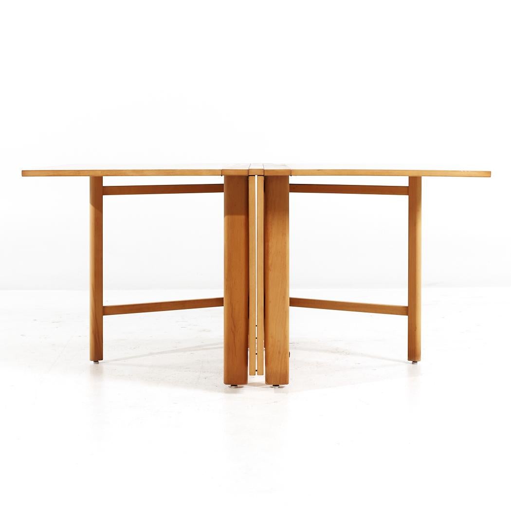 Dux Mid Century Maria Swedish Elm Beech and Brass Expanding Dining Table

The expanded table measures: 94.25 wide x 43.25 deep x 25.25 inches high, with a chair clearance of 24.5 inches, when not expanded the width is 9 inches

All pieces of