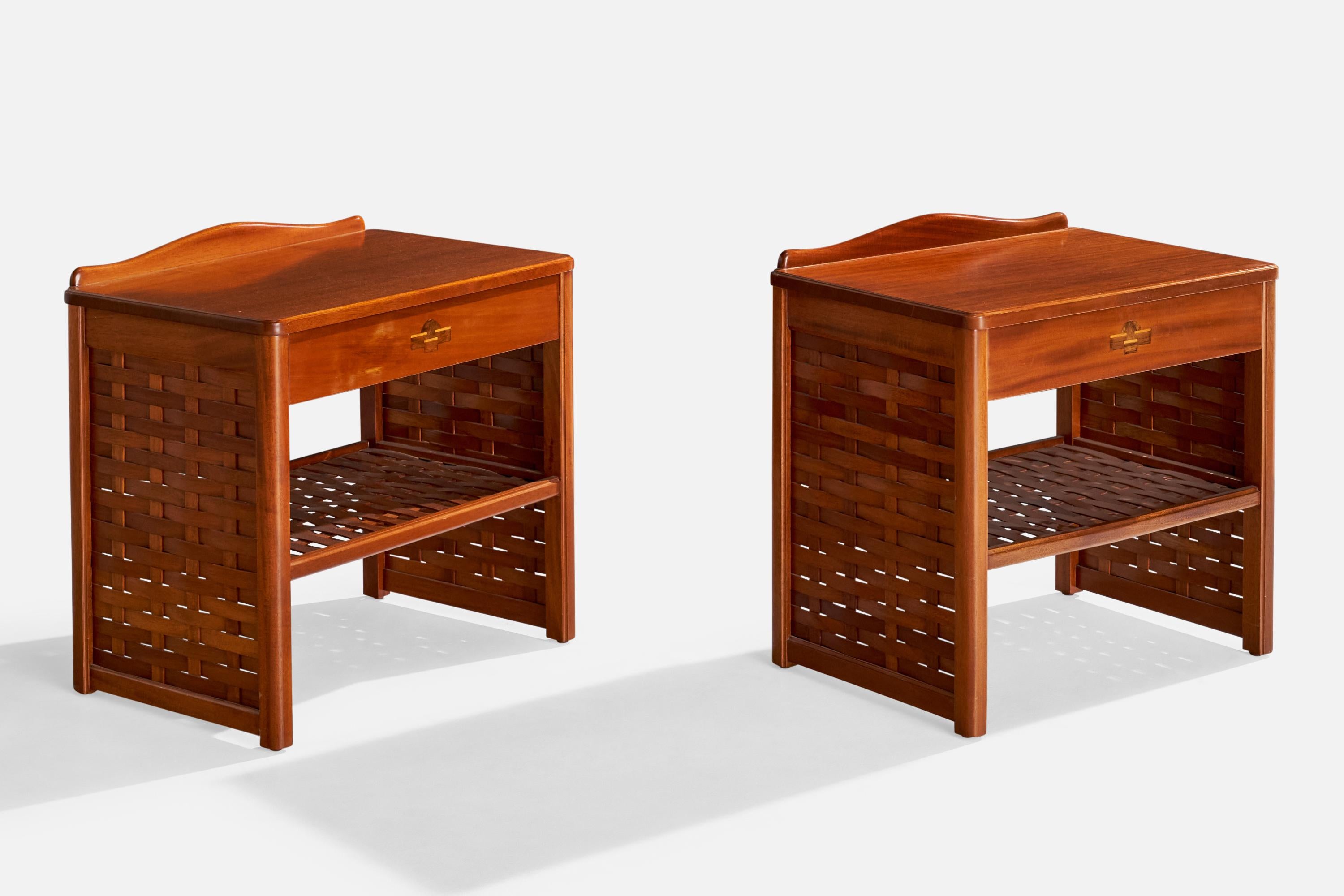 A pair of stained wood nightstands produced by Dux, Sweden, c. 1970s.

Dimensions: 22.75” H x 22.875” W x 15.375” D