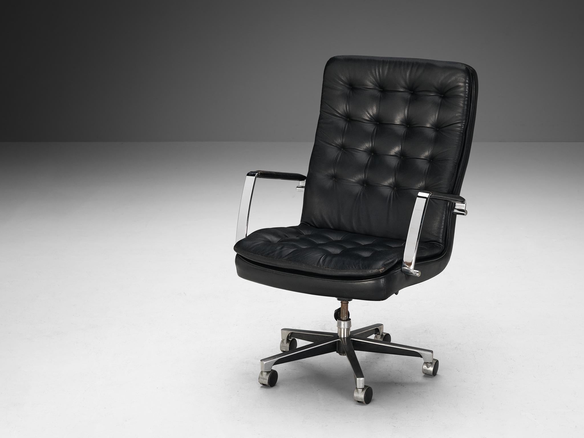 Dux of Sweden, office chair, leather, chrome-plated steel, aluminum, Sweden, 1970s

This comfortable and fully adjustable swiveling executive armchair is upholstered in black leather. The construction is based on a simplified design based on clear