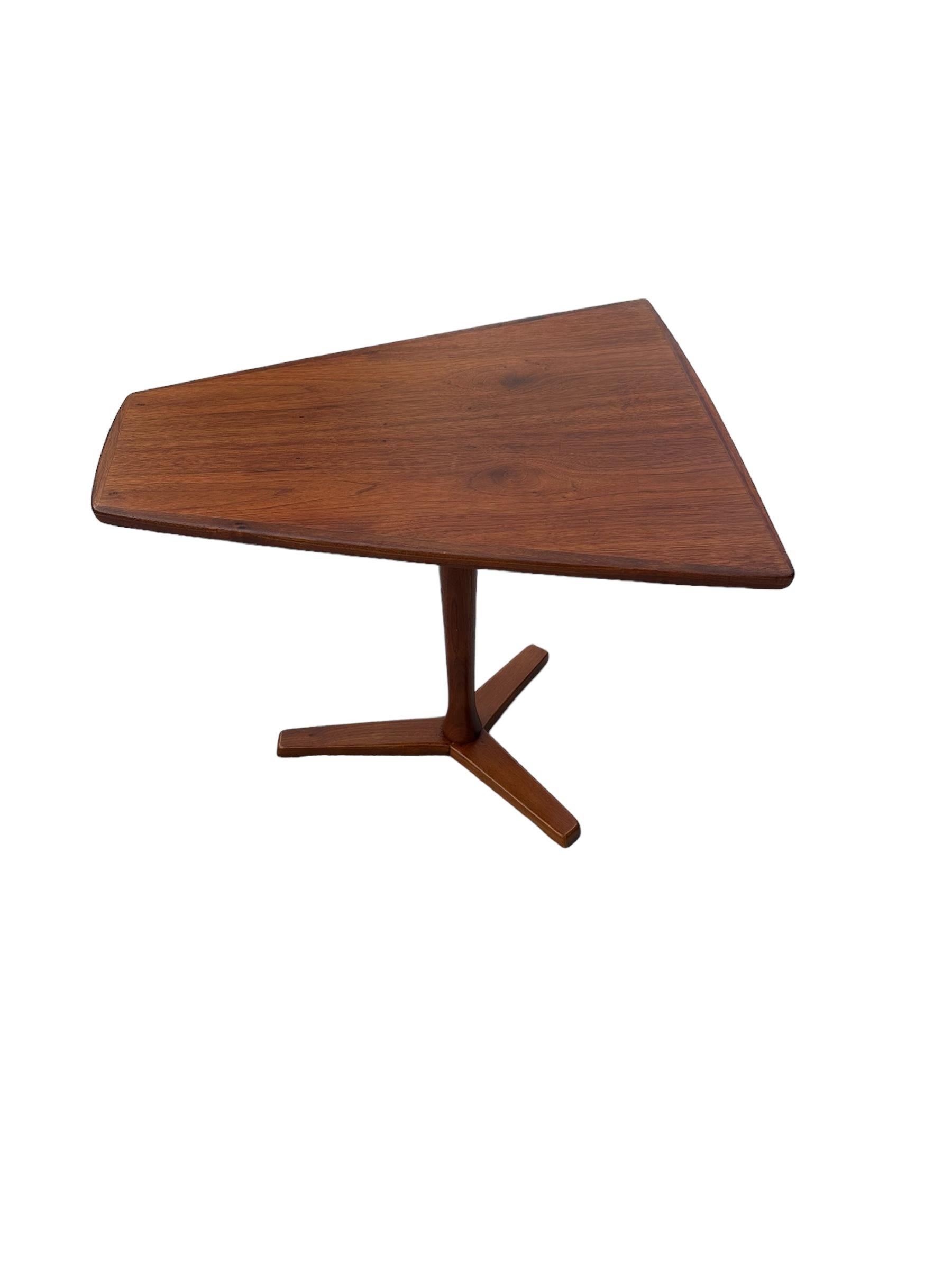 An elegant and very unique example of a beautiful Scandinavian design. Rare and unusual shape is perfect between two lounge chairs in the living room, or even as a standalone piece with its sculptural lines. This beautiful  side table was