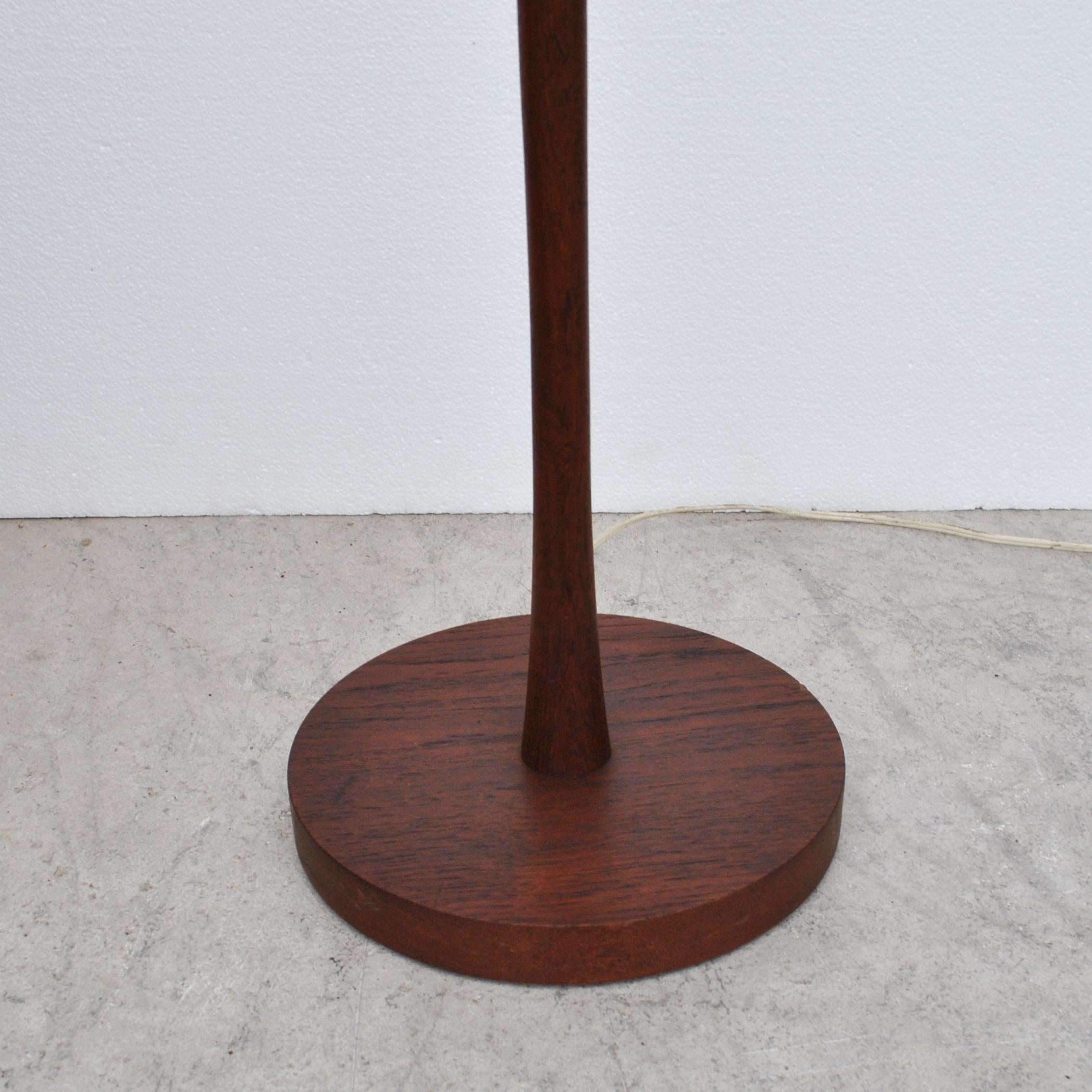 A mid century modern teak floor lamp made in Sweden by Dux.