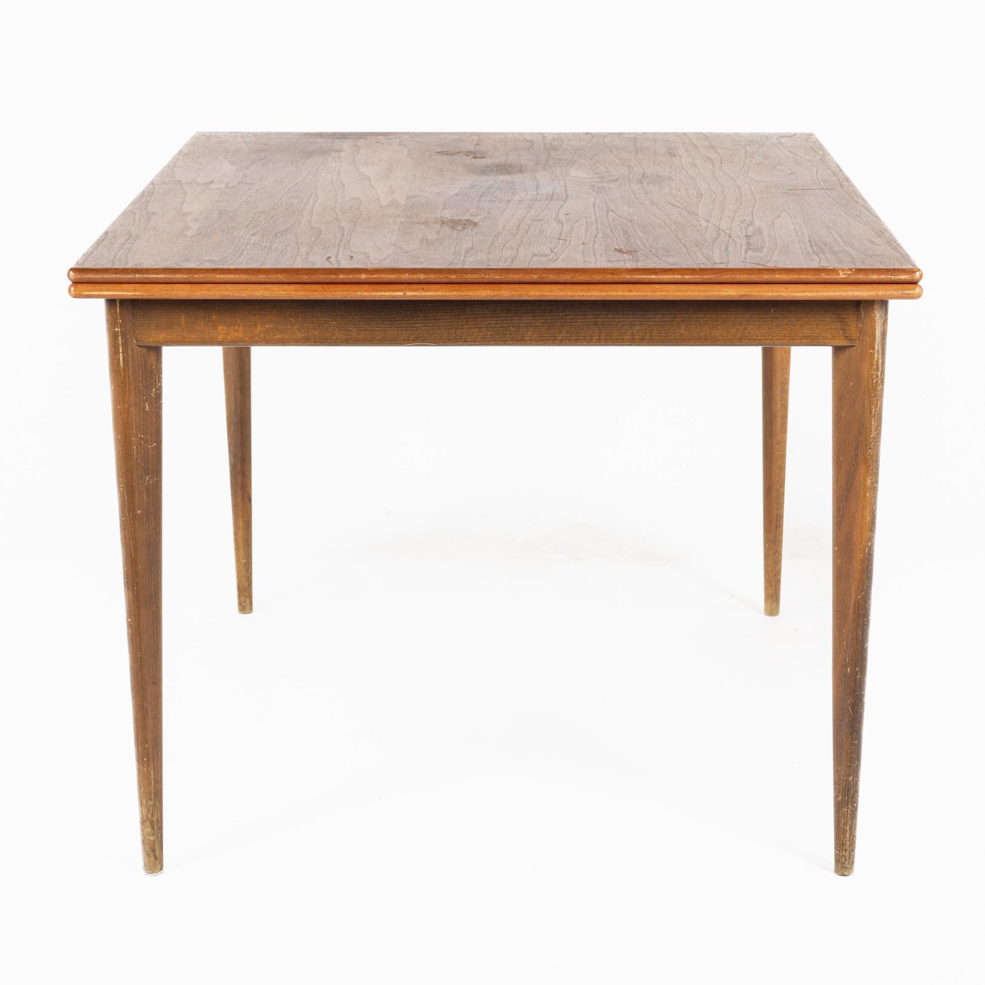Dux style walnut mid-century flip top dining table

This table measures: 71 wide x 35.5 deep x 29 inches high, with a chair clearance of 25 inches

All pieces of furniture can be had in what we call restored vintage condition. That means the