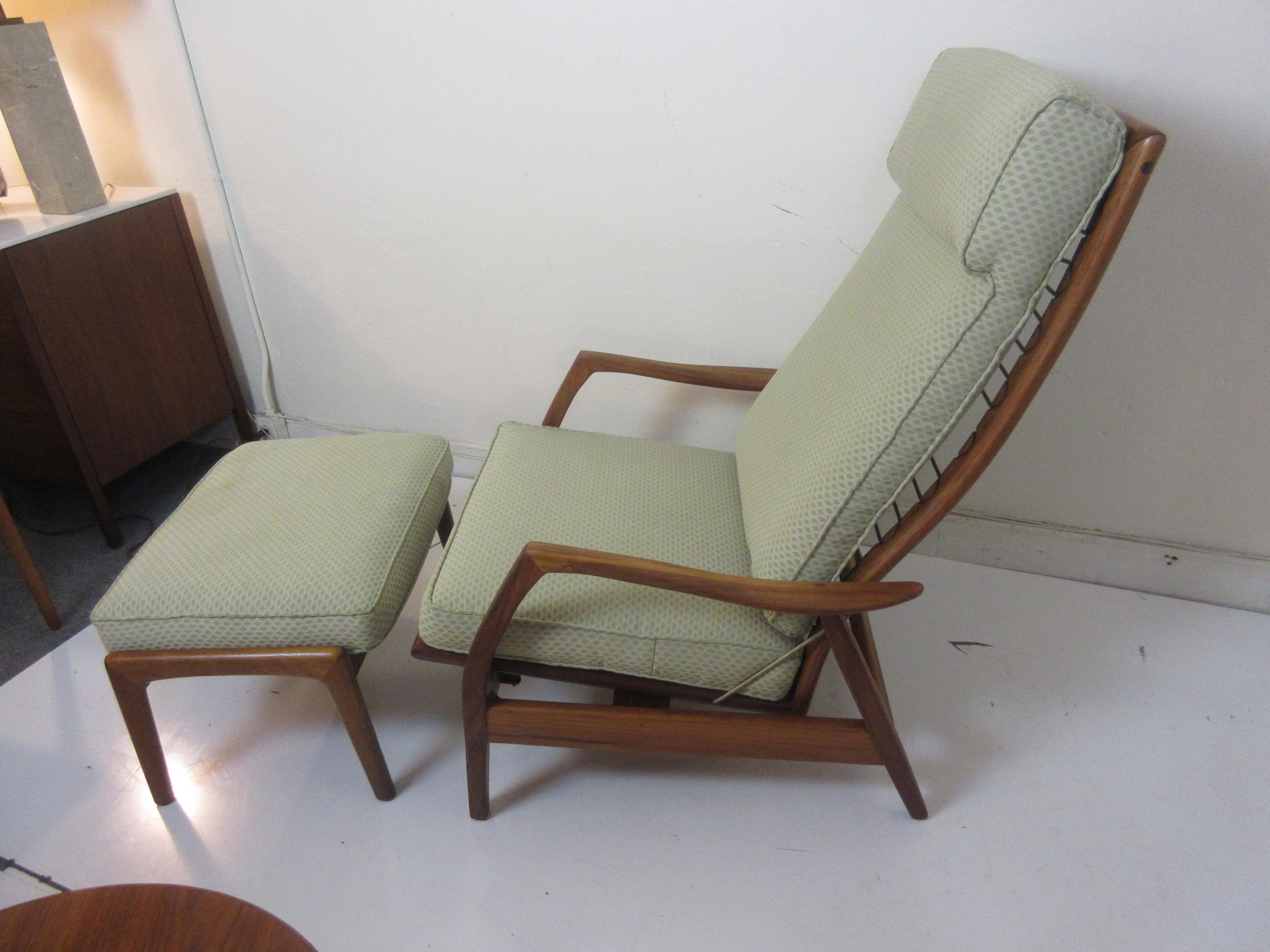 DUX teak lounge chair and ottoman with three positions and free rocking feature activated by the knob on lower right side of chair. Ottoman also has a slanted or flat adjustment shown in pictures. Frame has been refinished. Fabric is light green
