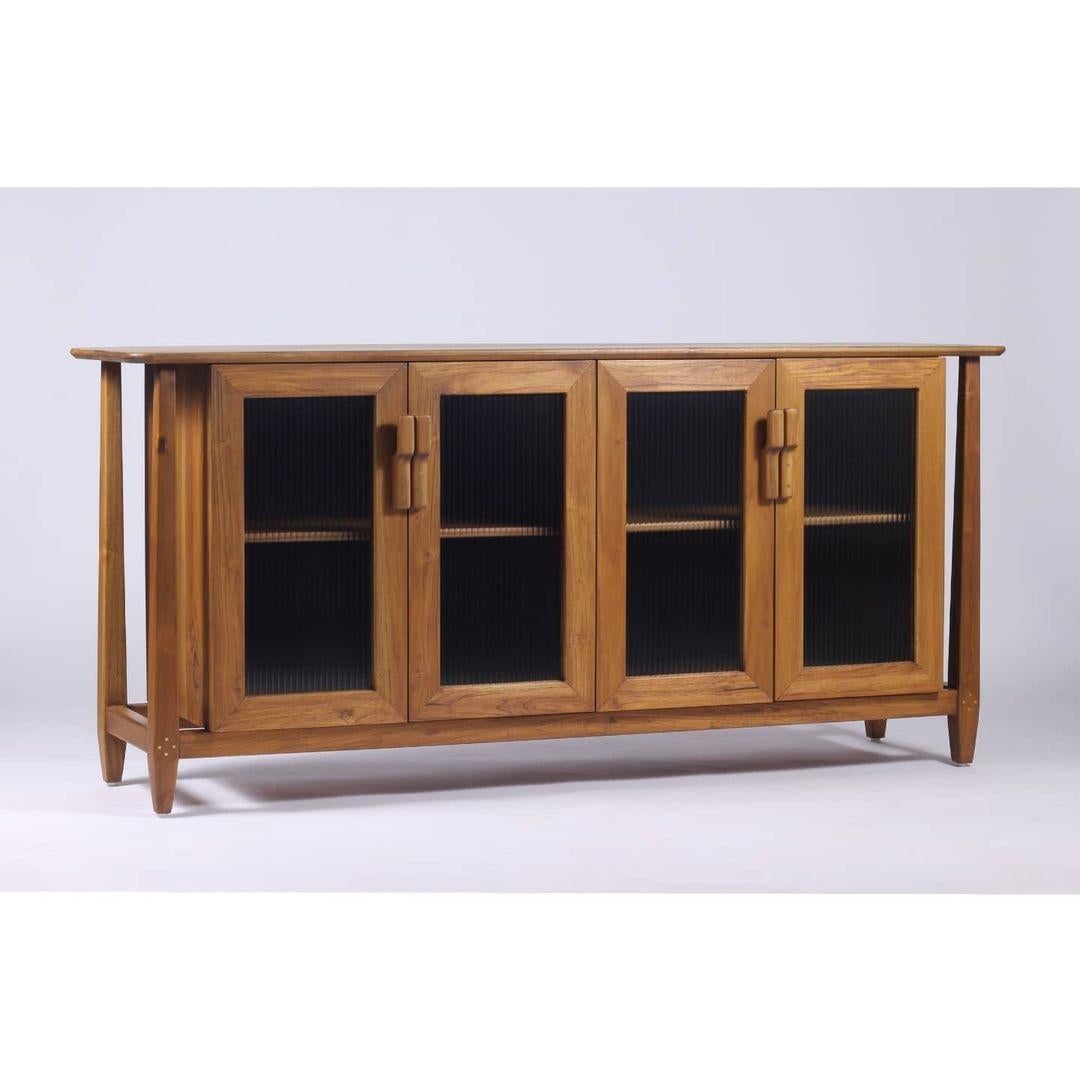 Dvaara Tan Brown Credenza by Esvee Atelier
Dimensions: D 49 x W 180 x H 81,2 cm.
Materials: Tan brown oak wood, solid brass and fluted glass.

Available in charcoal black and tan brown finishes. Please contact us.

The Dvaara Credenza/Sideboard