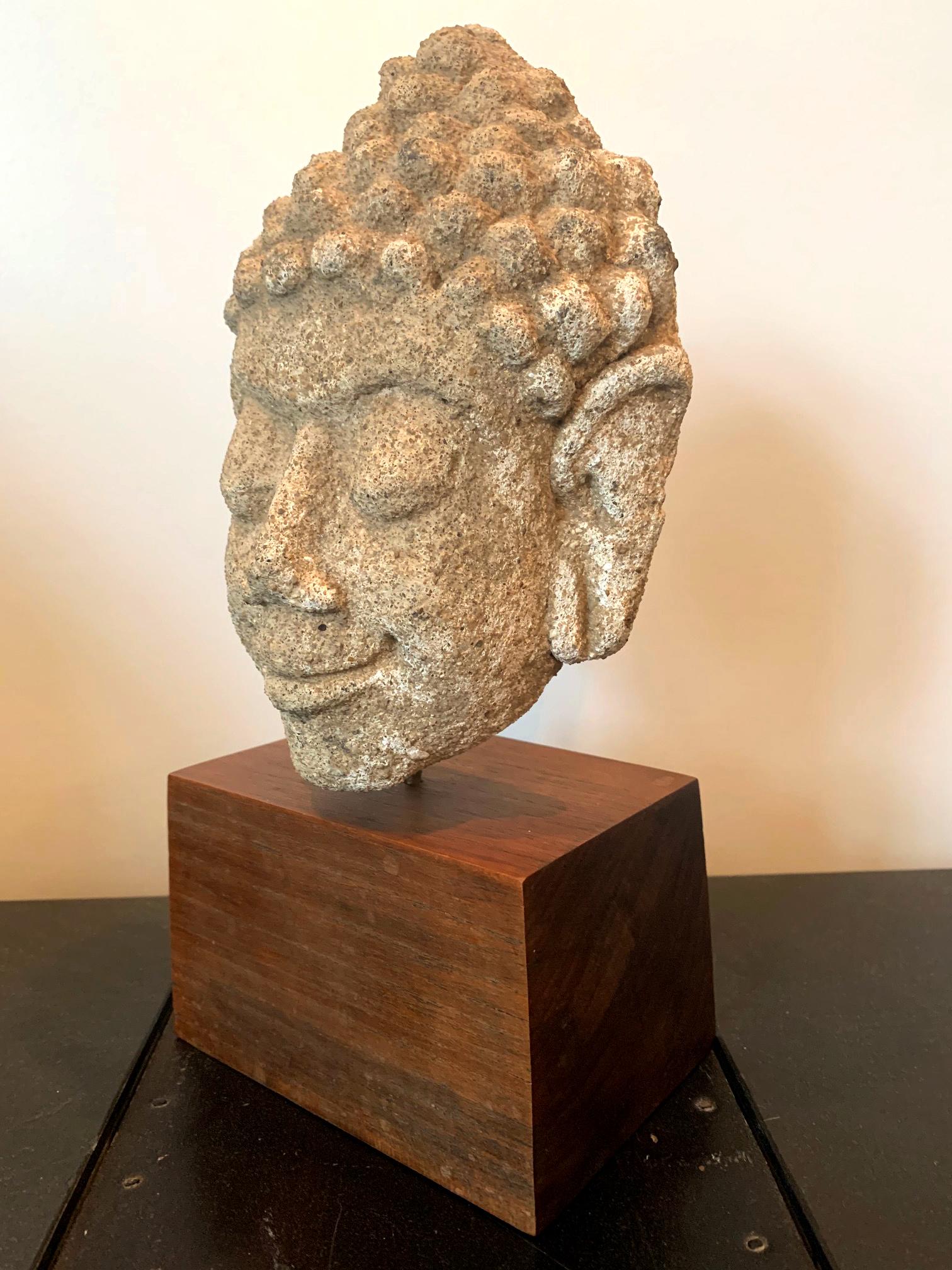 On offer is an early Buddha image from Dvaravati period (6-11th century) in Central Thailand. Made of stucco with an unfinished back suggesting its original use in architectural context. The Dvaravati period is the onset of the Buddhism image seen