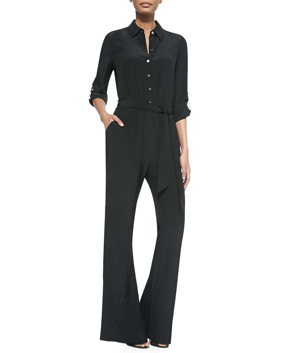 Diane von Furstenberg's black silk jumpsuit is an effortlessly stylish choice for any occasion. Crafted from fluid silk with a cinched waist and flared trousers, it's expertly tailored to create a sleek silhouette. 

    Diane von Furstenberg silk