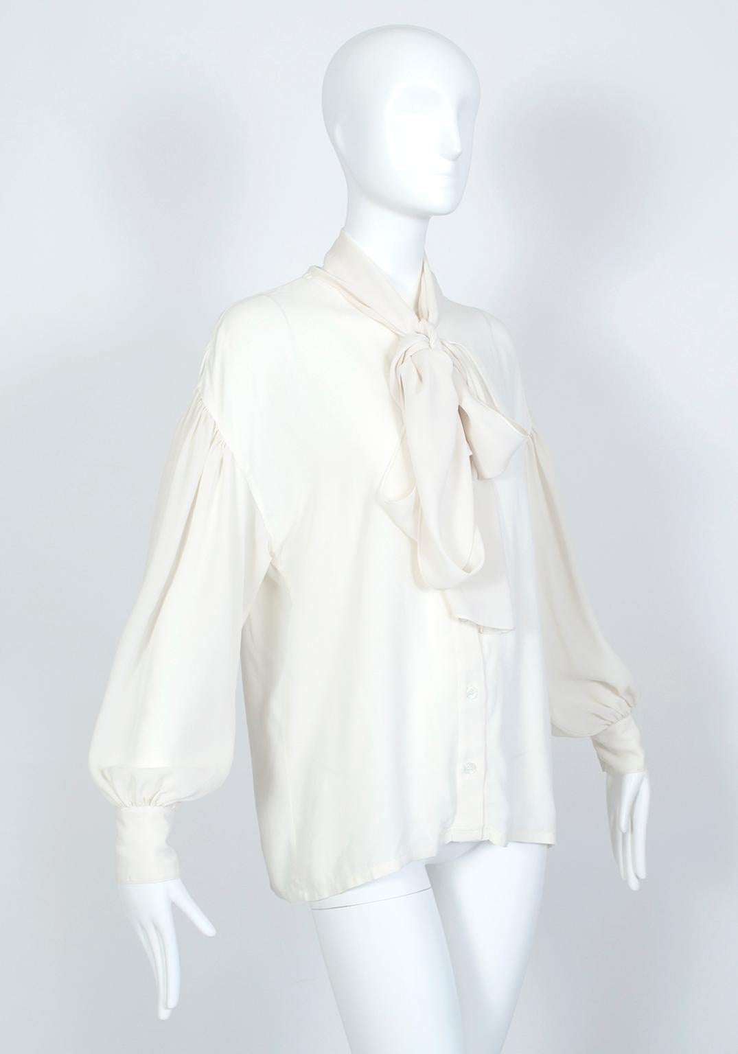 With a seven-foot neck sash and billowing drop sleeves, this romantic blouse offers endless styling possibilities. An ideal work-to-weekend piece, this blouse will mix seamlessly into your existing wardrobe but keeps your ensembles looking fresh