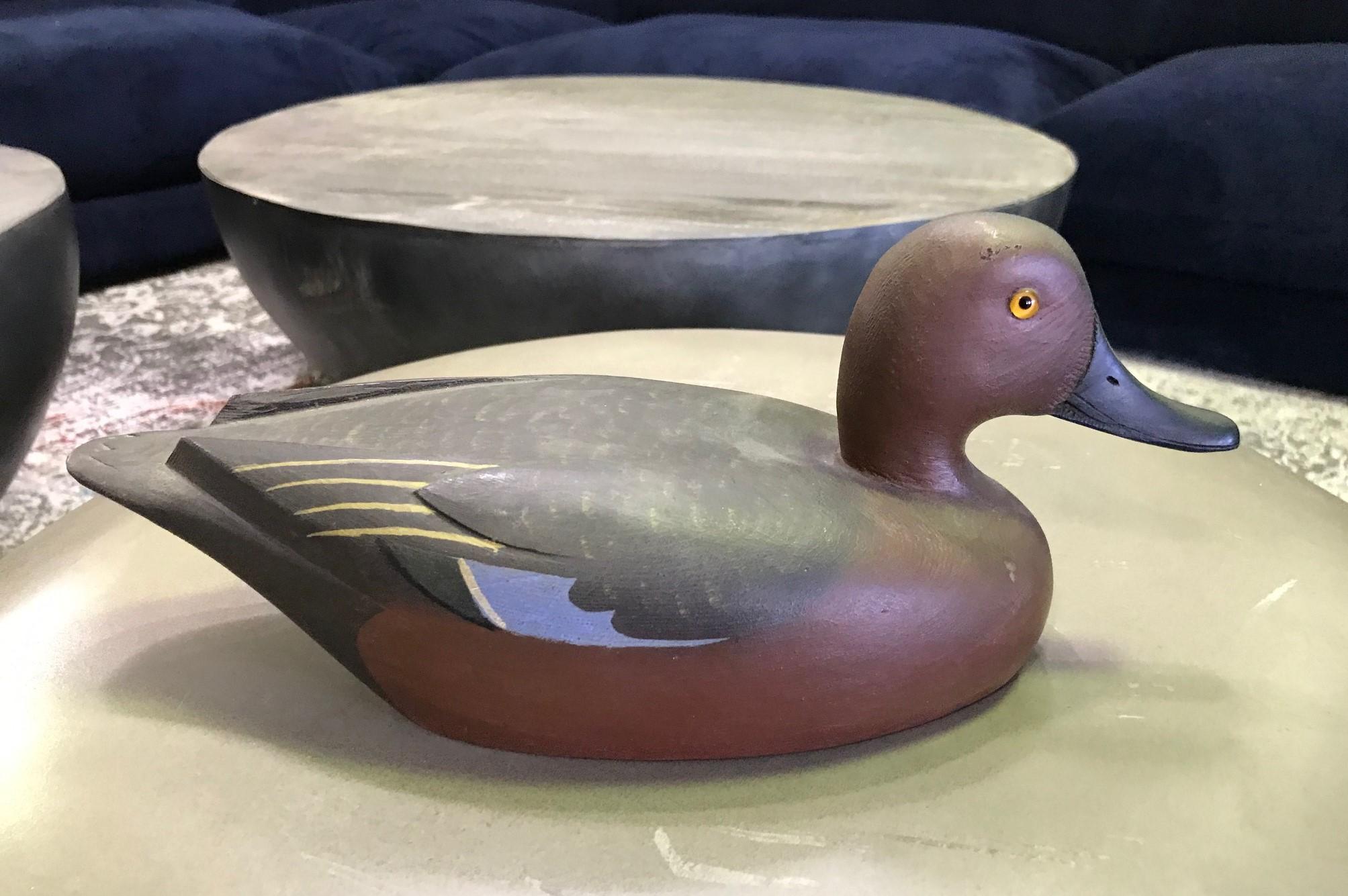 A wonderful work, a male cinnamon teal, hand carved and painted by renowned duck decoy artist D W Nichol. Beautifully crafted and decorated.

The work is signed 