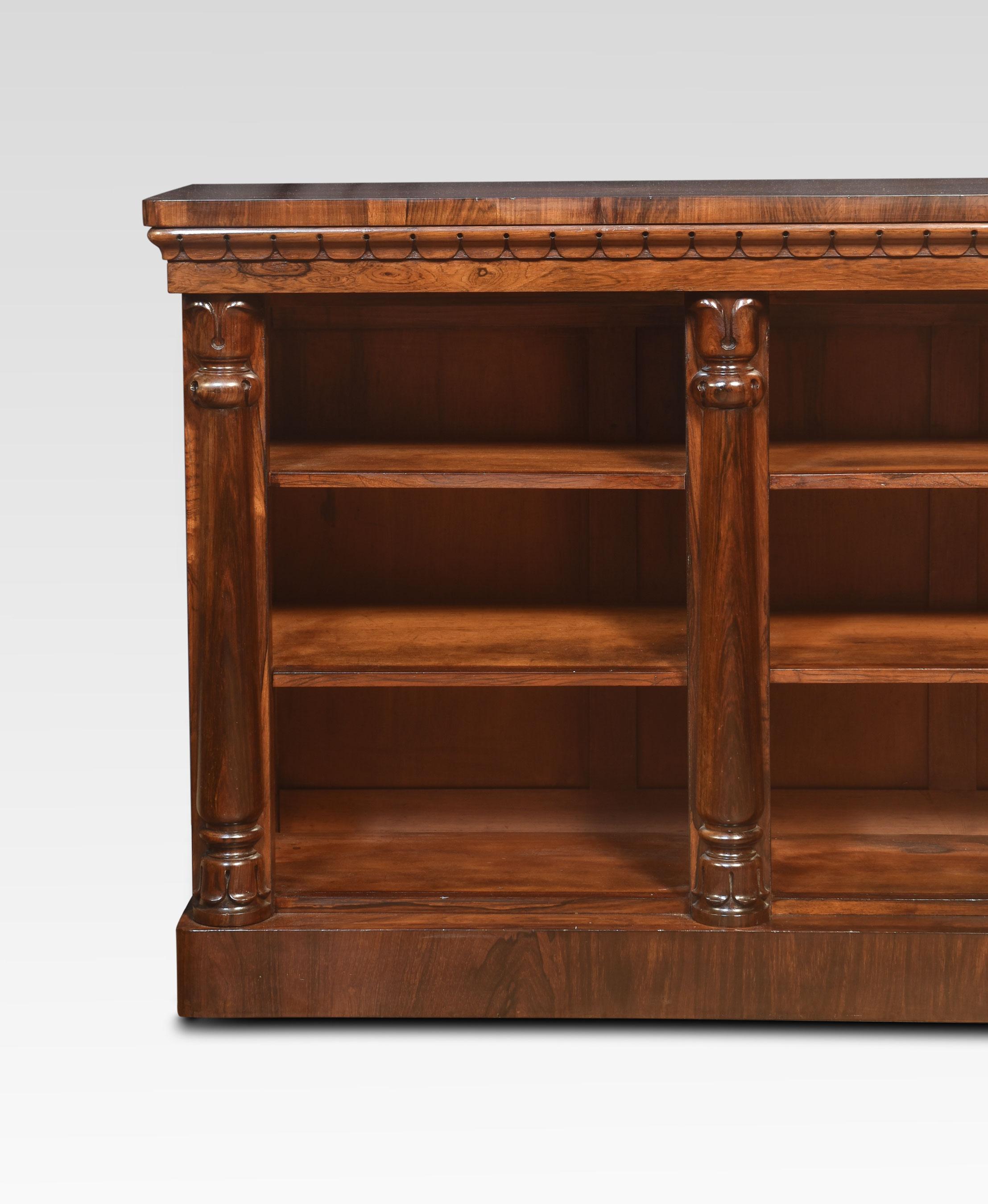 Rosewood open bookcase, the large rectangular well-figured top above three bays of adjustable shelves, divided by turned column pilasters. All raised up on a plinth base.
Dimensions
Height 36.5 Inches
Width 72 Inches
Depth 15.5 Inches.
