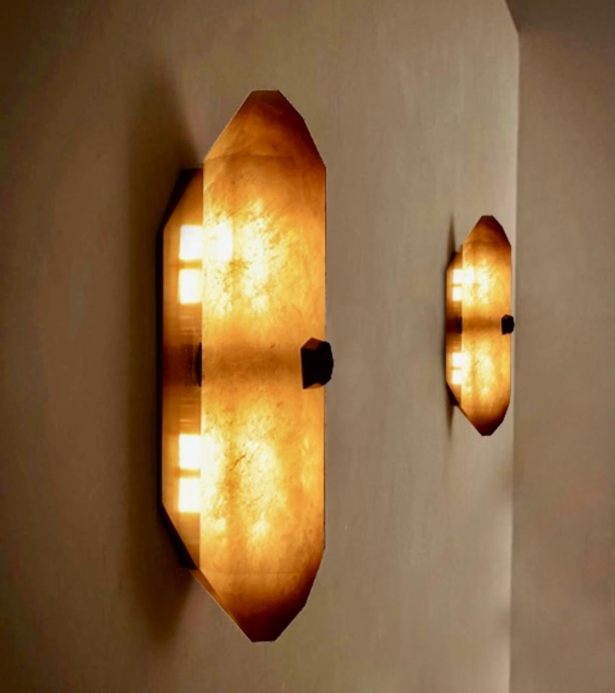 Contemporary Group of Four DWB Rock Crystal Sconces by Phoenix For Sale