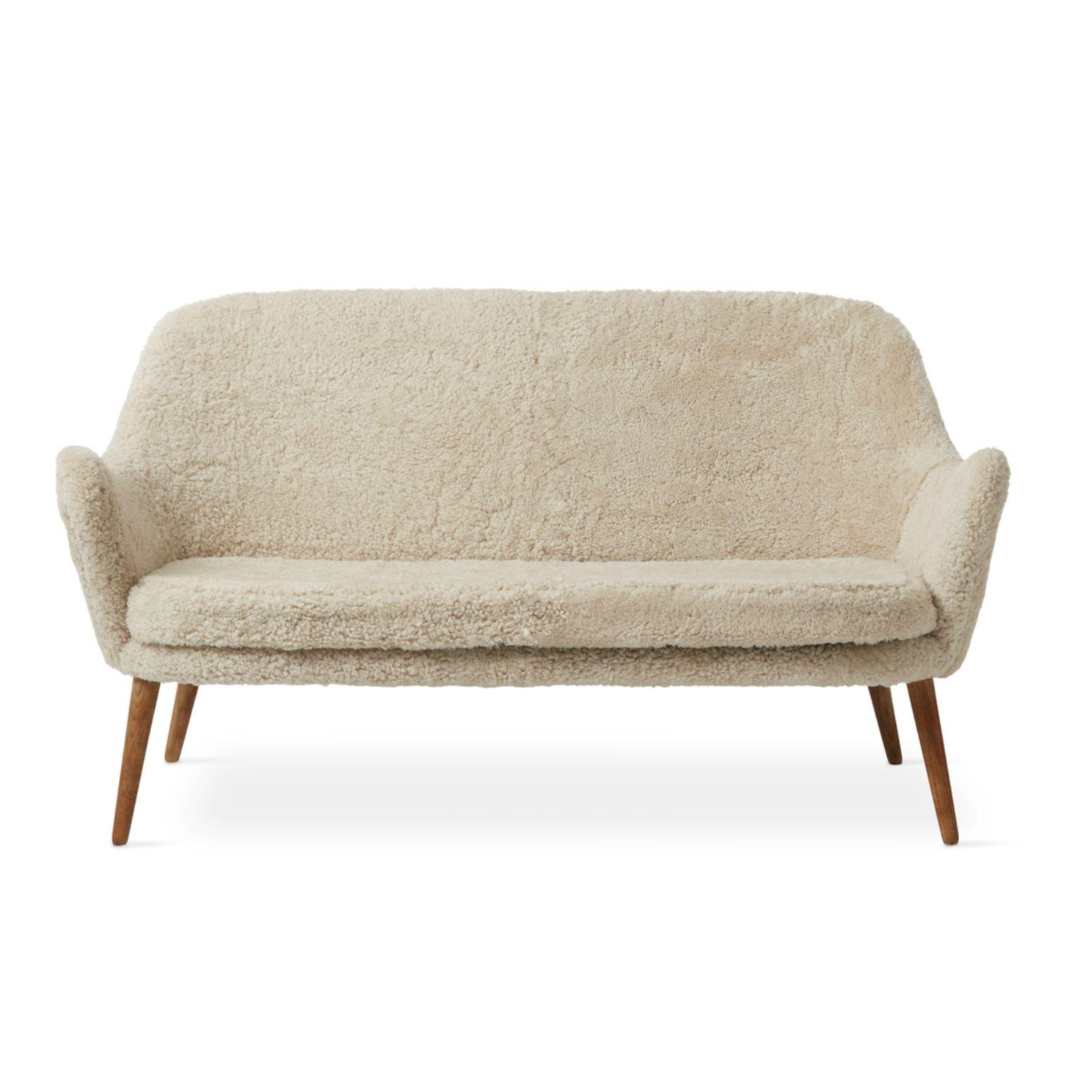Dwell 2 seater sheepskin moonlight by Warm Nordic.
Dimensions: D137 x W66 x H 73 cm.
Material: sheepskin upholstery, solid smoked or white oiled oak legs, wooden frame, foam, spring system.
Weight: 35 kg.
Also available in different colours and
