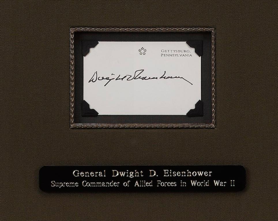 Offered is a custom signature collage, celebrating Dwight D. Eisenhower. The collage features Eisenhower's original signature on a card, which is paired with a black and white photograph of the five-star general. The signature appears in dark, bold